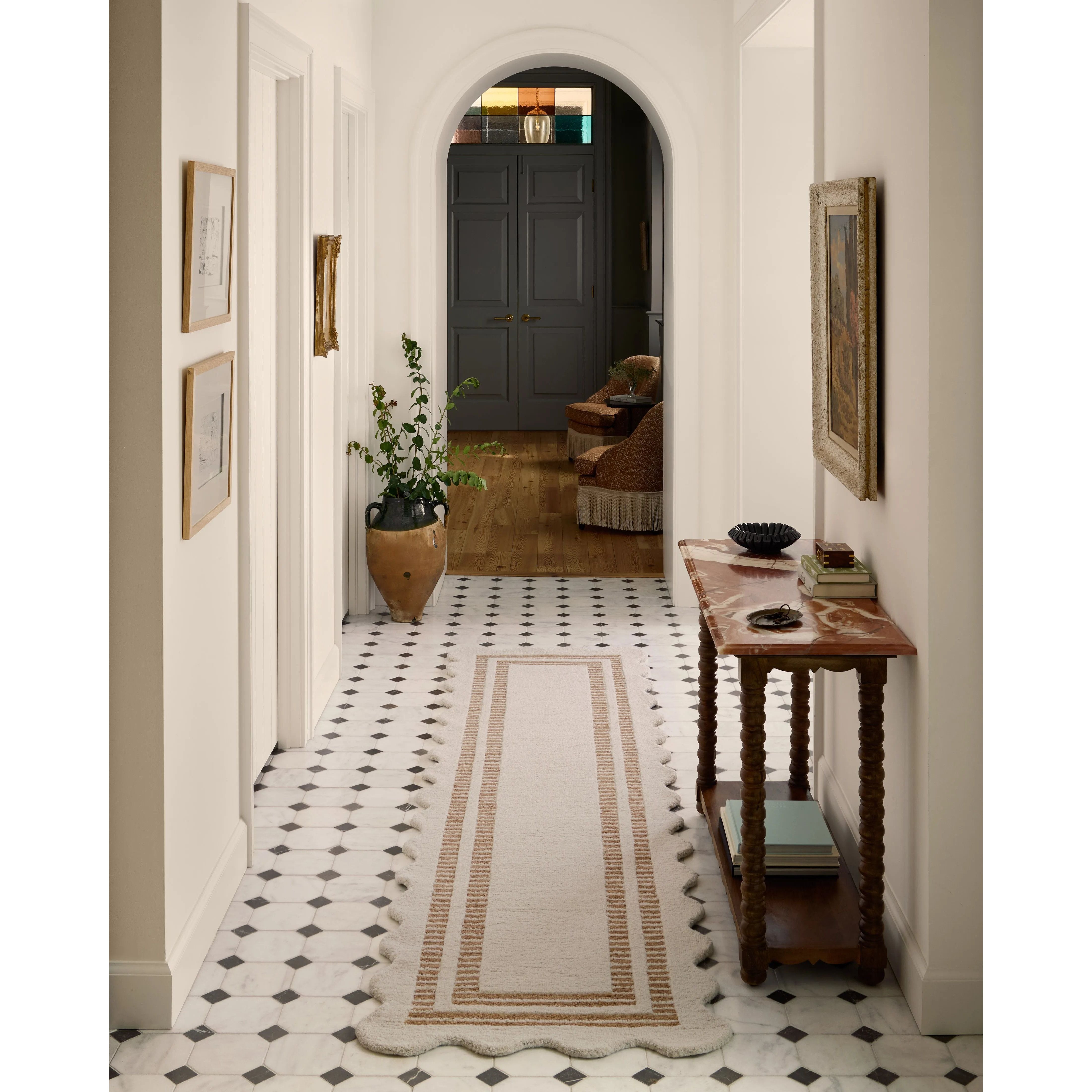 Featuring Chris Loves Julia × Loloi Scottie Ivory / Rust Rug by Loloi at Amethyst Home. The Scottie Collection from Chris Loves Julia x Loloi is a hand-tufted wool area rug with a playful scalloped edge and lower-pile, striped border for a touch of structure. The rugs overall pile is thick and plush, available in easygoing earth tones and neutral colorways.. Amethyst Home provides interior design, new home construction design consulting, vintage area rugs, and lighting in the Charlotte metro area.