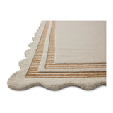 Featuring Chris Loves Julia × Loloi Scottie Ivory / Rust Rug by Loloi at Amethyst Home. The Scottie Collection from Chris Loves Julia x Loloi is a hand-tufted wool area rug with a playful scalloped edge and lower-pile, striped border for a touch of structure. The rugs overall pile is thick and plush, available in easygoing earth tones and neutral colorways. T. Amethyst Home provides interior design, new home construction design consulting, vintage area rugs, and lighting in the Houston metro area.