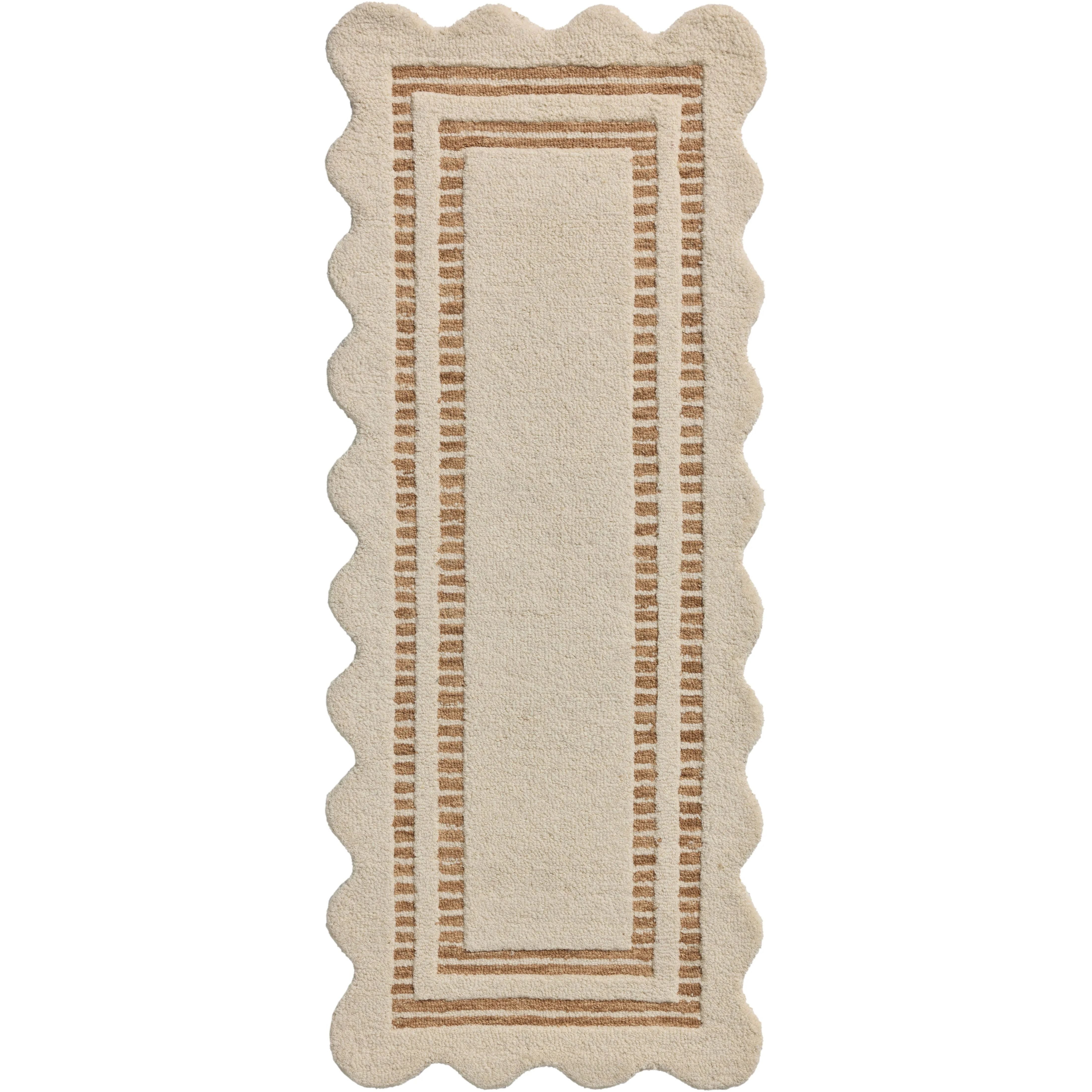 Featuring Chris Loves Julia × Loloi Scottie Ivory / Rust Rug by Loloi at Amethyst Home. The Scottie Collection from Chris Loves Julia x Loloi is a hand-tufted wool area rug with a playful scalloped edge and lower-pile, striped border for a touch of structure. The rugs overall pile is thick and plush, available in easygoing earth tones and neutral colorways.. Amethyst Home provides interior design, new home construction design consulting, vintage area rugs, and lighting in the Nashville metro area.