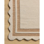 Featuring Chris Loves Julia × Loloi Scottie Ivory / Rust Rug by Loloi at Amethyst Home. The Scottie Collection from Chris Loves Julia x Loloi is a hand-tufted wool area rug with a playful scalloped edge and lower-pile, striped border for a touch of structure. The rugs overall pile is thick and plush, available in easygoing earth tones and neutral colorways.. Amethyst Home provides interior design, new home construction design consulting, vintage area rugs, and lighting in the Park City metro area.