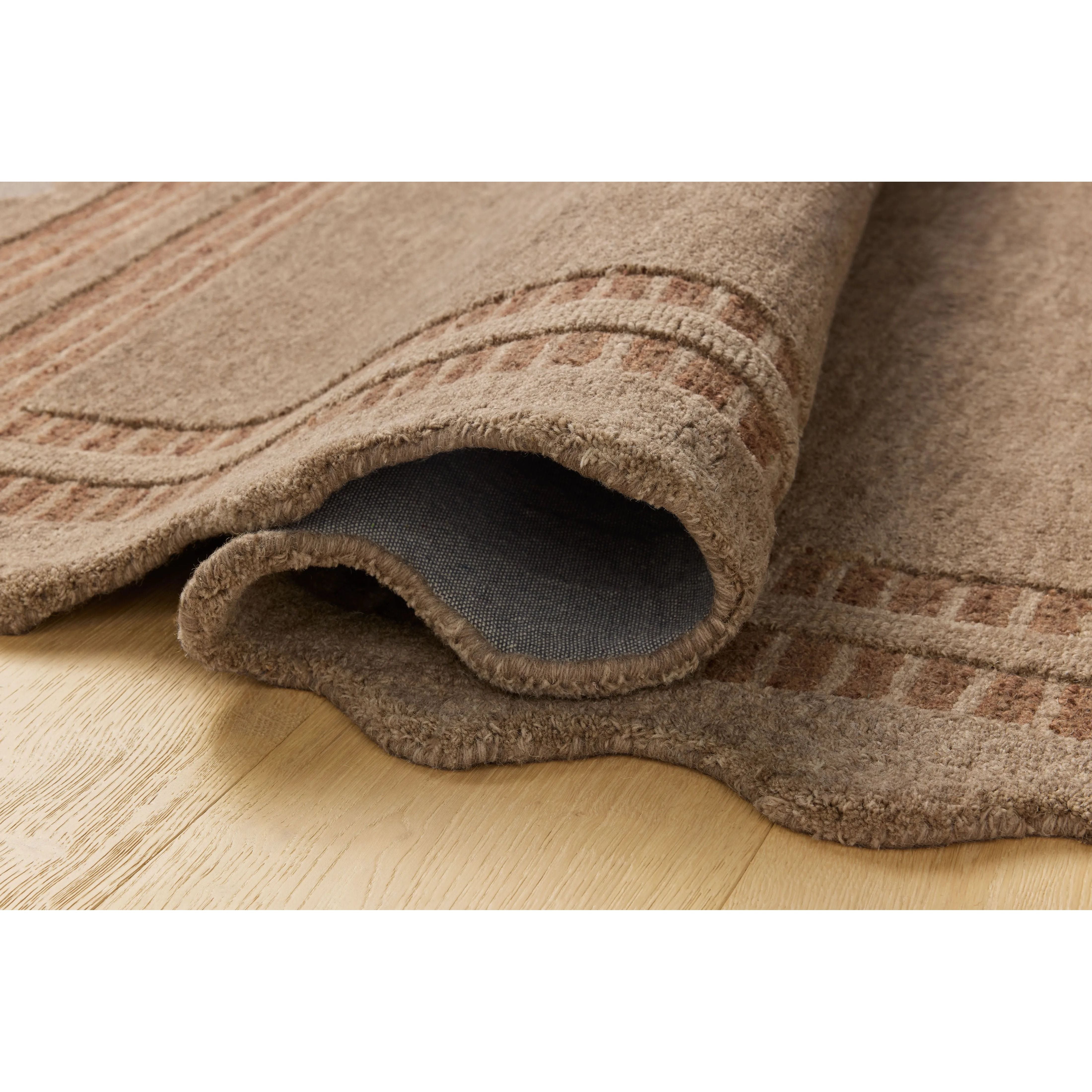 Featuring Chris Loves Julia × Loloi Scottie Mocha / Clay Rug by Loloi at Amethyst Home. The Scottie Collection from Chris Loves Julia x Loloi is a hand-tufted wool area rug with a playful scalloped edge and lower-pile, striped border for a touch of structure. The rugs overall pile is thick and plush, available in easygoing earth tones and neutral colorways. . Amethyst Home provides interior design, new home construction design consulting, vintage area rugs, and lighting in the Portland metro area.