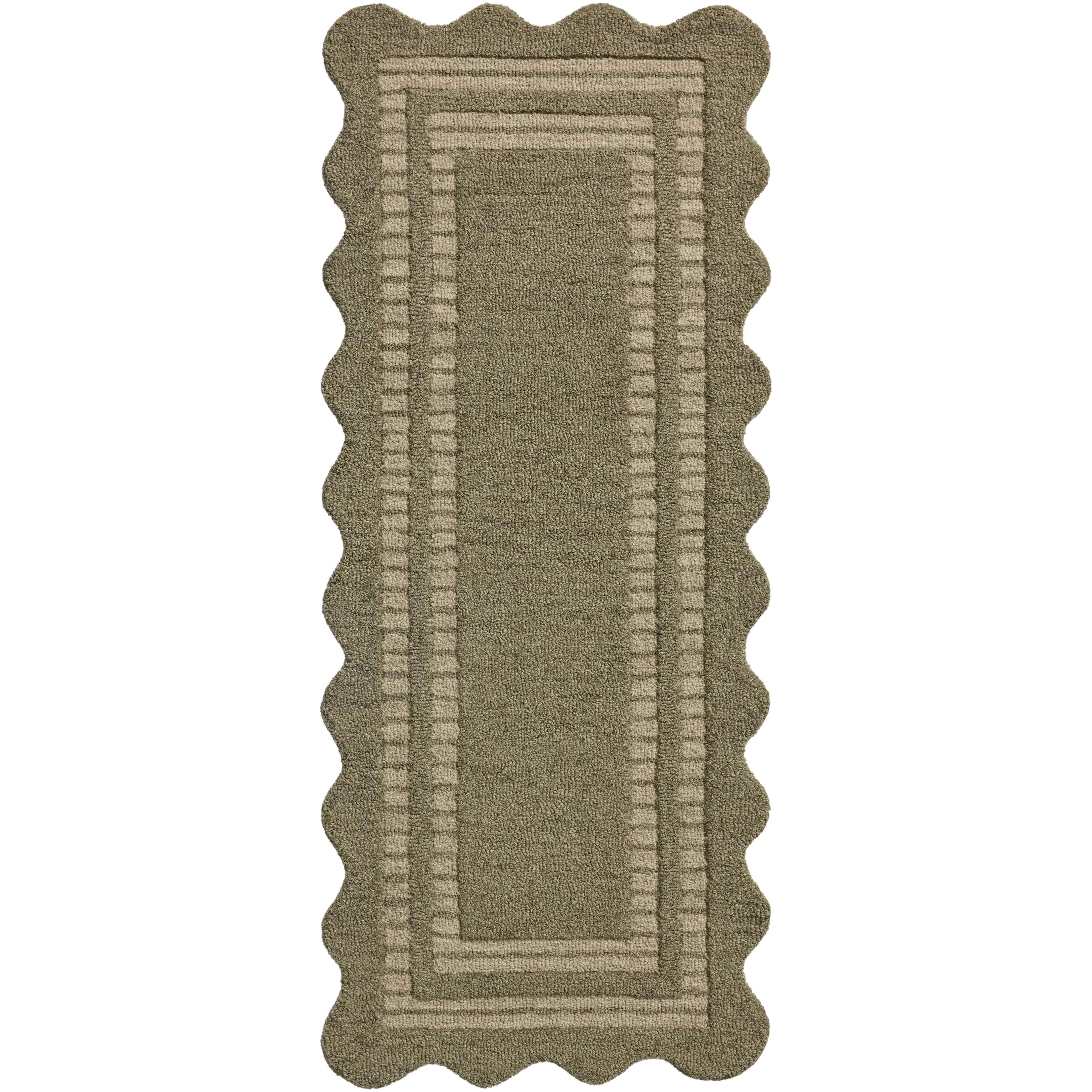 Featuring Chris Loves Julia × Loloi Scottie Olive / Pebble Rug by Loloi at Amethyst Home. The Scottie Collection from Chris Loves Julia x Loloi is a hand-tufted wool area rug with a playful scalloped edge and lower-pile, striped border for a touch of structure. The rugs overall pile is thick and plush, available in easygoing earth tones and neutral colorway. Amethyst Home provides interior design, new home construction design consulting, vintage area rugs, and lighting in the Charlotte metro area.