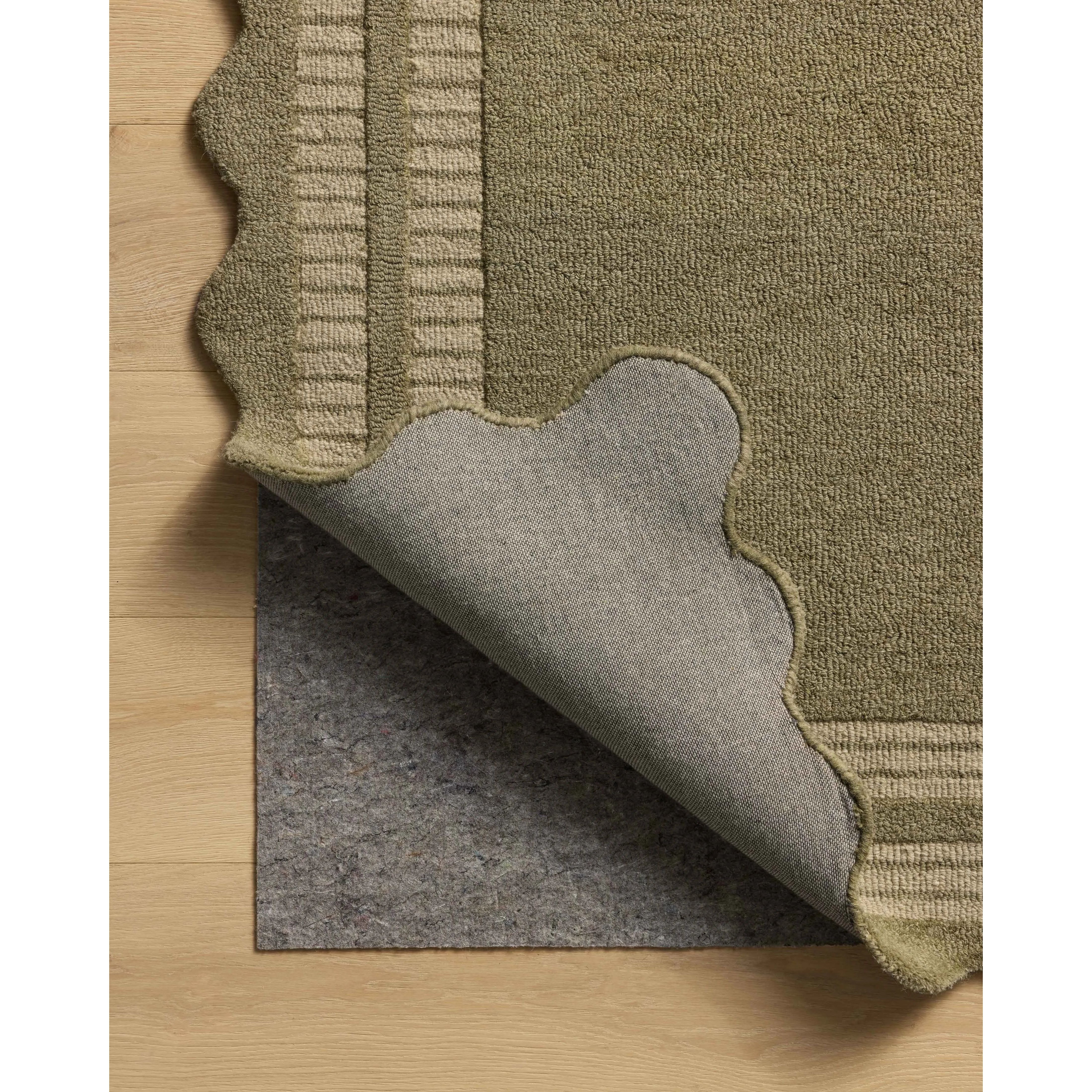 Featuring Chris Loves Julia × Loloi Scottie Olive / Pebble Rug by Loloi at Amethyst Home. The Scottie Collection from Chris Loves Julia x Loloi is a hand-tufted wool area rug with a playful scalloped edge and lower-pile, striped border for a touch of structure. The rugs overall pile is thick and plush, available in easygoing earth tones and neutral color. Amethyst Home provides interior design, new home construction design consulting, vintage area rugs, and lighting in the Laguna Beach metro area.