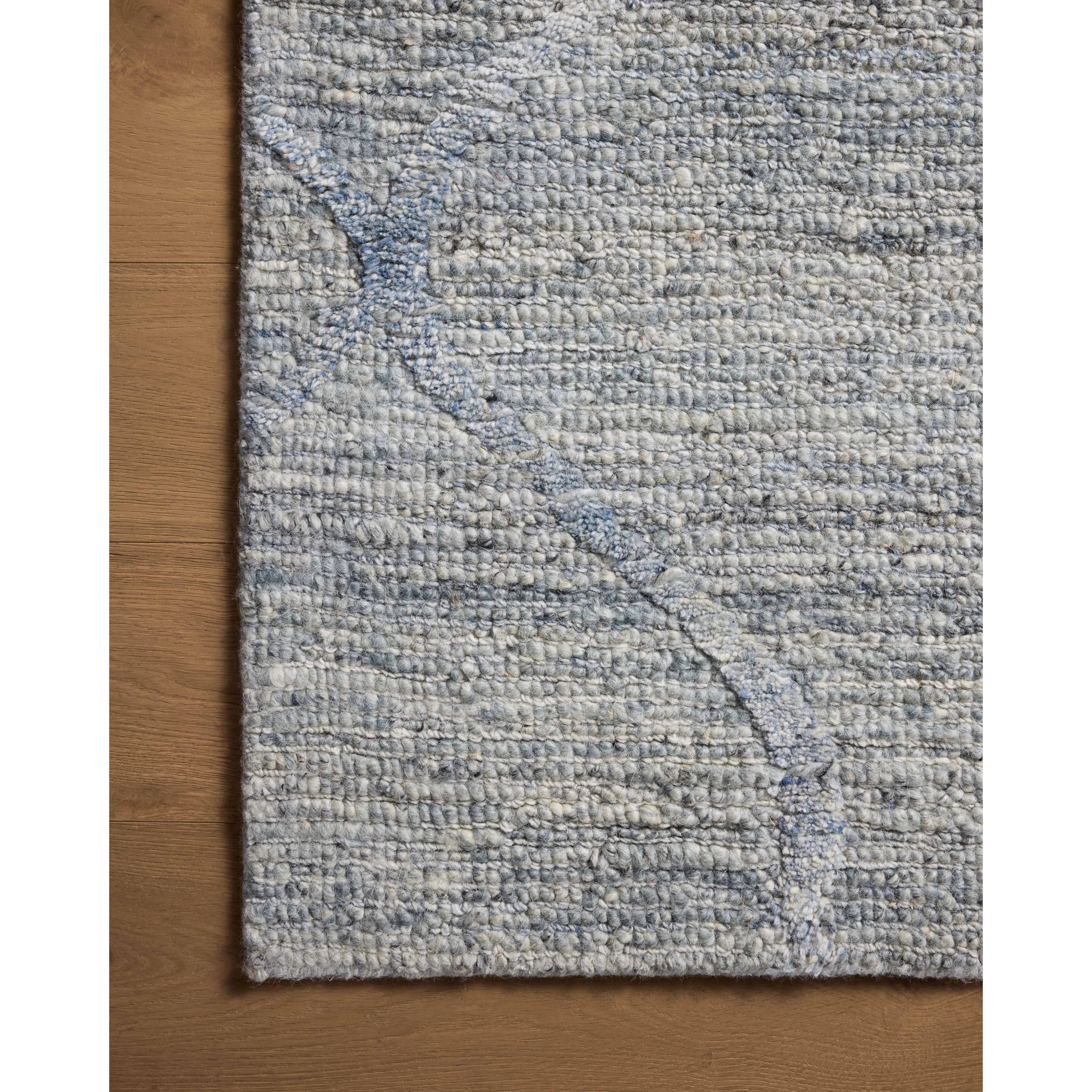 Featuring Cline Sky Rug by Loloi at Amethyst Home. The Cline Collection is a hand-woven area rug with loose, organic raised patterns across a pleasantly chunky pile. The rug's palette is inspired by color-flecked stones, making it a dynamic neutral in living rooms, bedrooms, and more. This collection is made of 100% wool in India and GoodWeave-certified, en. Amethyst Home provides interior design, new home construction design consulting, vintage area rugs, and lighting in the San Diego metro area.