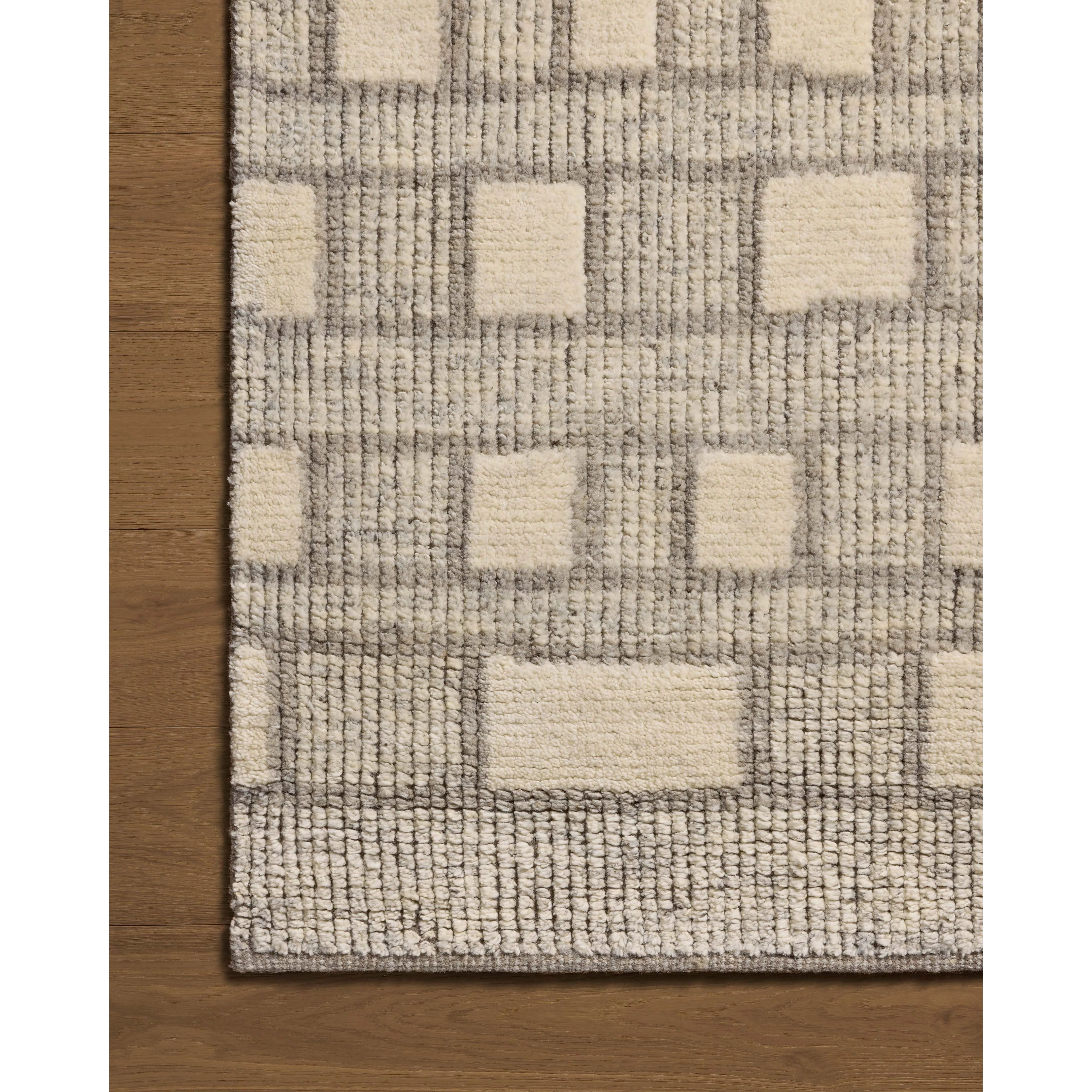 Featuring David Jean Stoffer x Loloi Grey Hand-Knotted Rug by Loloi at Amethyst Home. Unexpected stripes trace along the David Collection, a hand-knotted area rug with a plush, luxurious presence. Abstract patterns are carved into the design for a richly textured pile that's satisfying to sink into. This collection is made of 100% wool in India and Good. Amethyst Home provides interior design, new home construction design consulting, vintage area rugs, and lighting in the Newport Beach metro area.