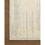 Featuring David Jean Stoffer x Loloi Ivory Hand-Knotted Rug by Loloi at Amethyst Home. Unexpected stripes trace along the David Collection, a hand-knotted area rug with a plush, luxurious presence. Abstract patterns are carved into the design for a richly textured pile that's satisfying to sink into. This collection is made of 100% wool in India and GoodWea. Amethyst Home provides interior design, new home construction design consulting, vintage area rugs, and lighting in the San Diego metro area.
