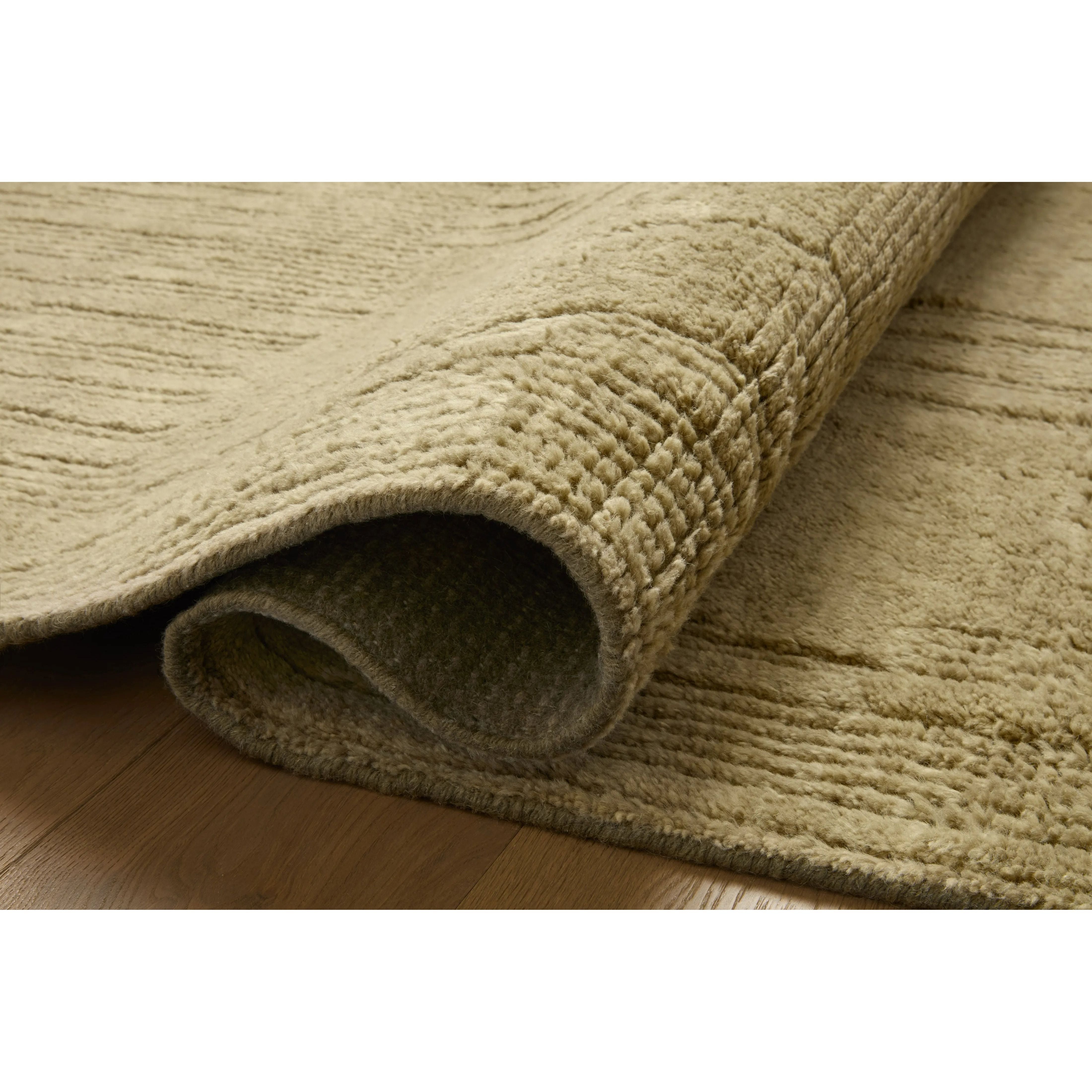 Featuring David Jean Stoffer x Loloi Olive Hand-Knotted Rug by Loloi at Amethyst Home. Unexpected stripes trace along the David Collection, a hand-knotted area rug with a plush, luxurious presence. Abstract patterns are carved into the design for a richly textured pile that's satisfying to sink into. This collection is made of 100% wool in India and Goo. Amethyst Home provides interior design, new home construction design consulting, vintage area rugs, and lighting in the Newport Beach metro area.