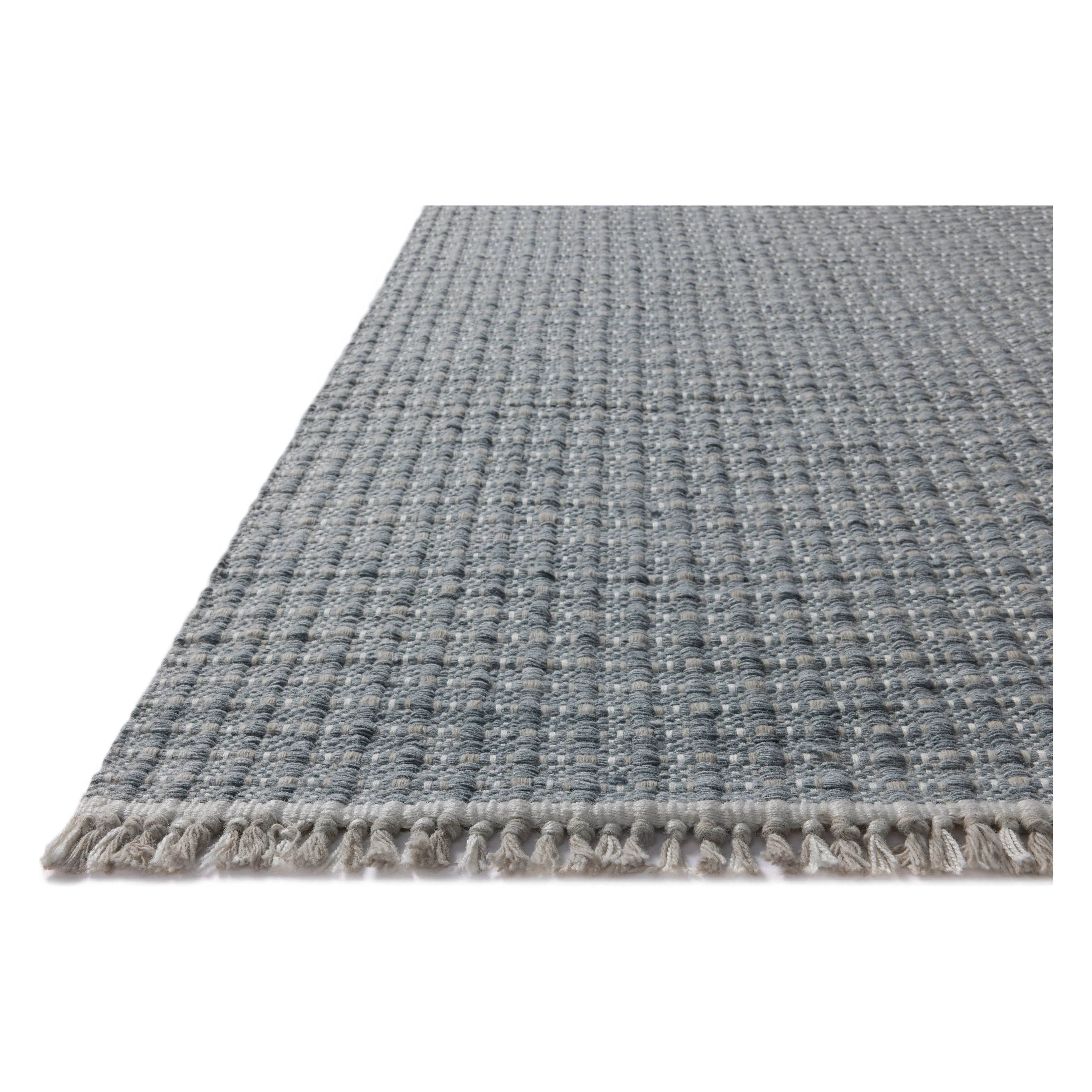 The Duncan Collection is a handmade area rug thats interwoven with white threads for subtle contrast and finished with fringed edges. This collection is soft yet exceptionally durable and easy to clean, making it right at home in busy living rooms, entryways, dining rooms, and outdoor patios. Amethyst Home provides interior design, new home construction design consulting, vintage area rugs, and lighting in the Alpharetta metro area.