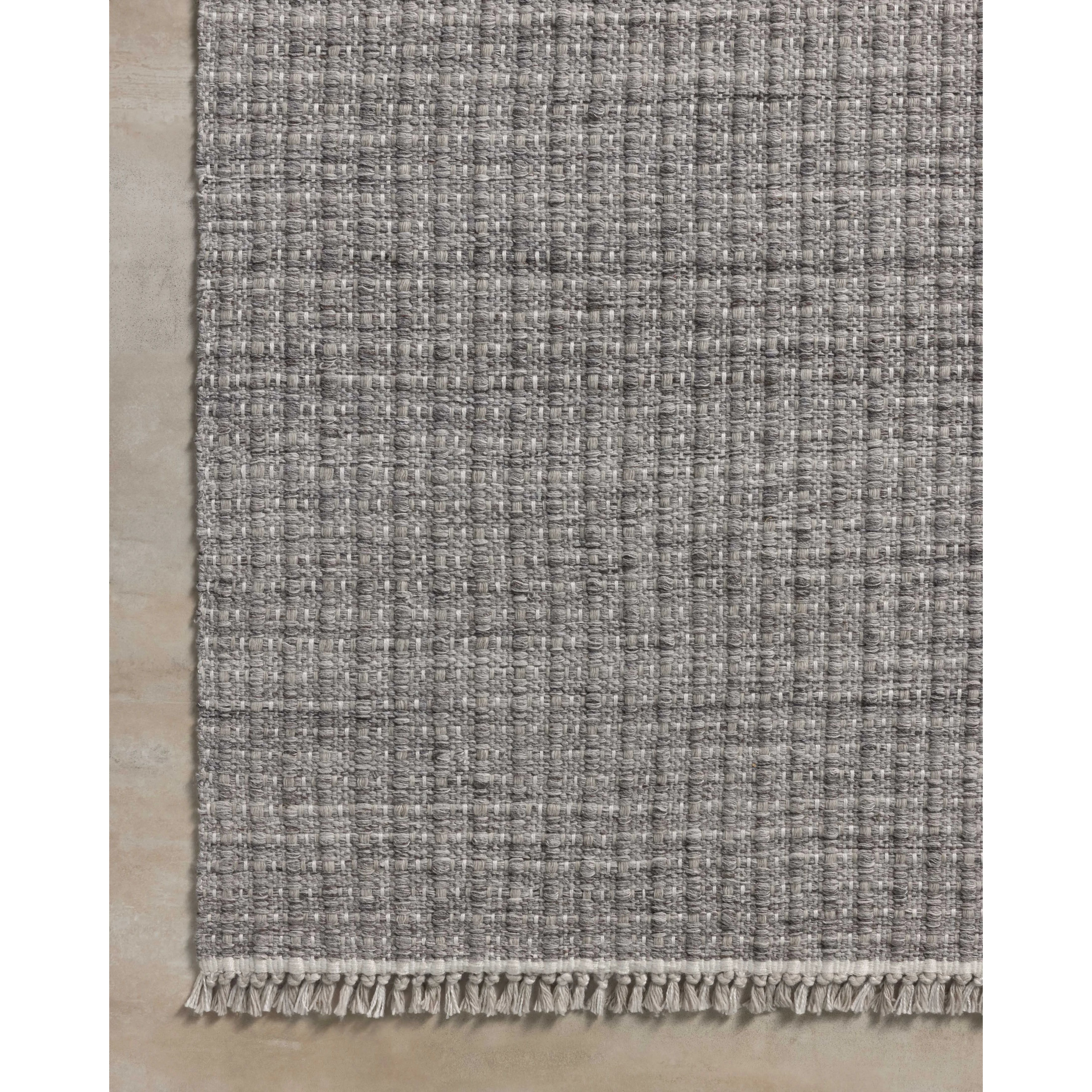 The Duncan Collection is a handmade area rug thats interwoven with white threads for subtle contrast and finished with fringed edges. This collection is soft yet exceptionally durable and easy to clean, making it right at home in busy living rooms, entryways, dining rooms, and outdoor patios. Amethyst Home provides interior design, new home construction design consulting, vintage area rugs, and lighting in the Seattle metro area.