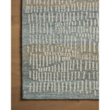 The Elias Ocean / Oatmeal Rug is a hand-tufted wool area rug with lively graphic patterns in earth and stone tones. There’s a unique texture to the rug made by over-tufting, in which a design is hand-tufted over a tufted base, creating a subtle high-low pile. Amethyst Home provides interior design, new home construction design consulting, vintage area rugs, and lighting in the Calabasas metro area.