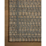 The Elias Wheat / Charcoal Rug is a hand-tufted wool area rug with lively graphic patterns in earth and stone tones. There’s a unique texture to the rug made by over-tufting, in which a design is hand-tufted over a tufted base, creating a subtle high-low pile. Amethyst Home provides interior design, new home construction design consulting, vintage area rugs, and lighting in the Alpharetta metro area.