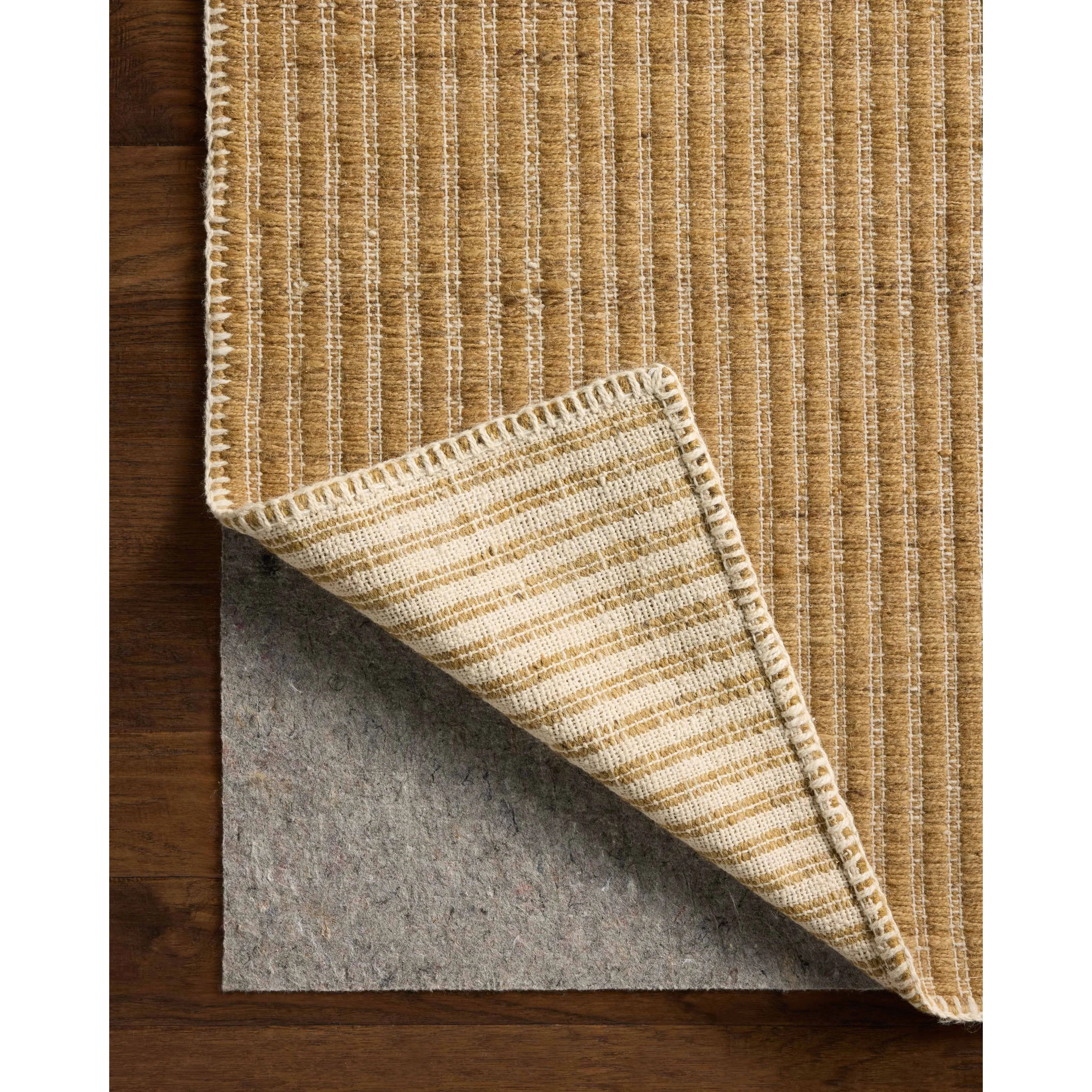 The Elma Collection is a vertically striped area rug framed with whip-stitched edges to help ground your space. This timeless, neutral rug is great for high-traffic living rooms, bedrooms, and dining rooms of many home decor styles. Amethyst Home provides interior design, new home construction design consulting, vintage area rugs, and lighting in the Omaha metro area.
