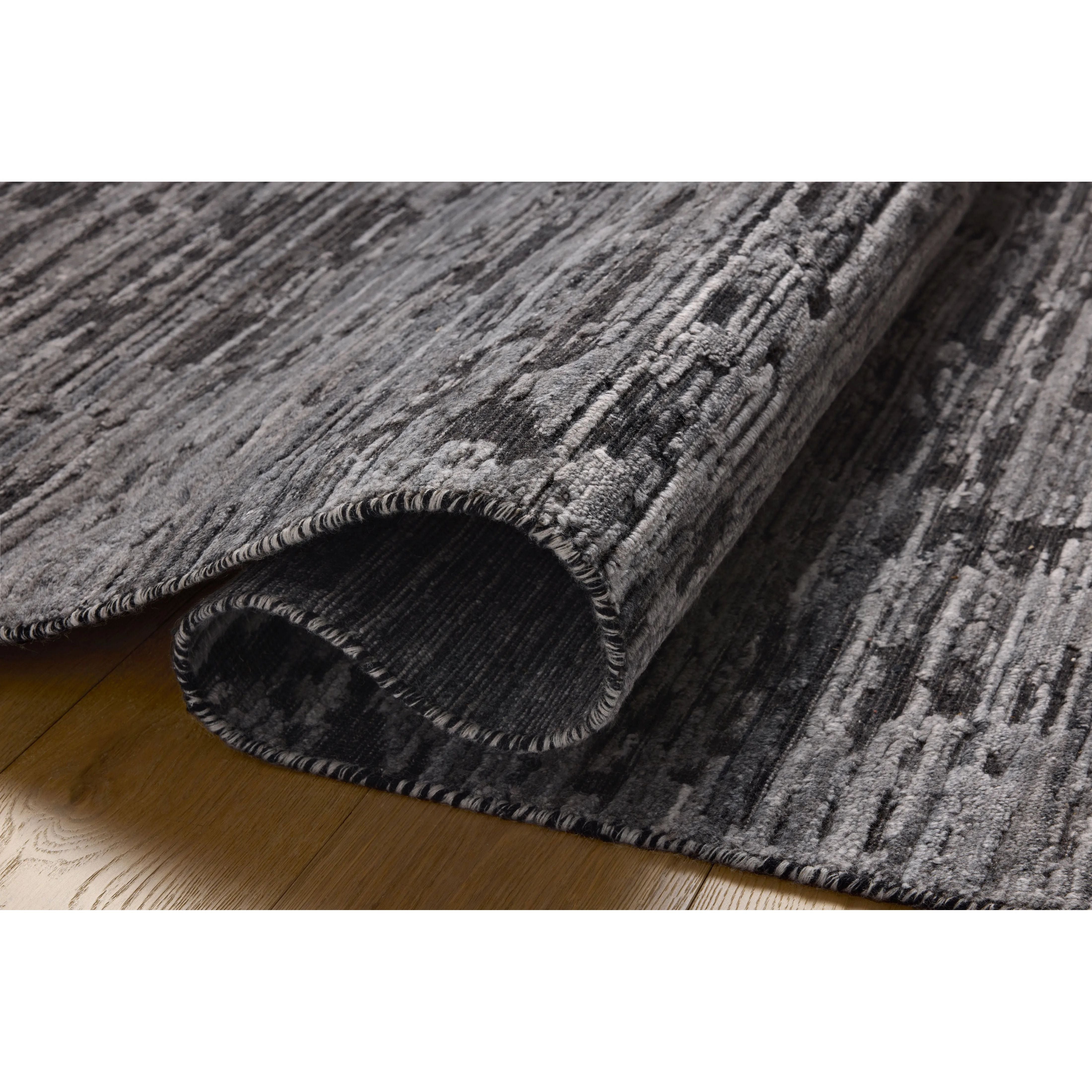 Featuring Jean Stoffer x Loloi Daniel Charcoal Rug by Loloi at Amethyst Home. Area rugs in the Daniel Charcoal Rug have a graphic design in a range of tonal palettes with a soft, gently ribbed texture. The hand-loomed pile is a blend of bamboo and wool with a slight sheen that captures the light and changes the rug’s sense of depth throughout the day. The . Amethyst Home provides interior design, new home construction design consulting, vintage area rugs, and lighting in the Scottsdale metro area.