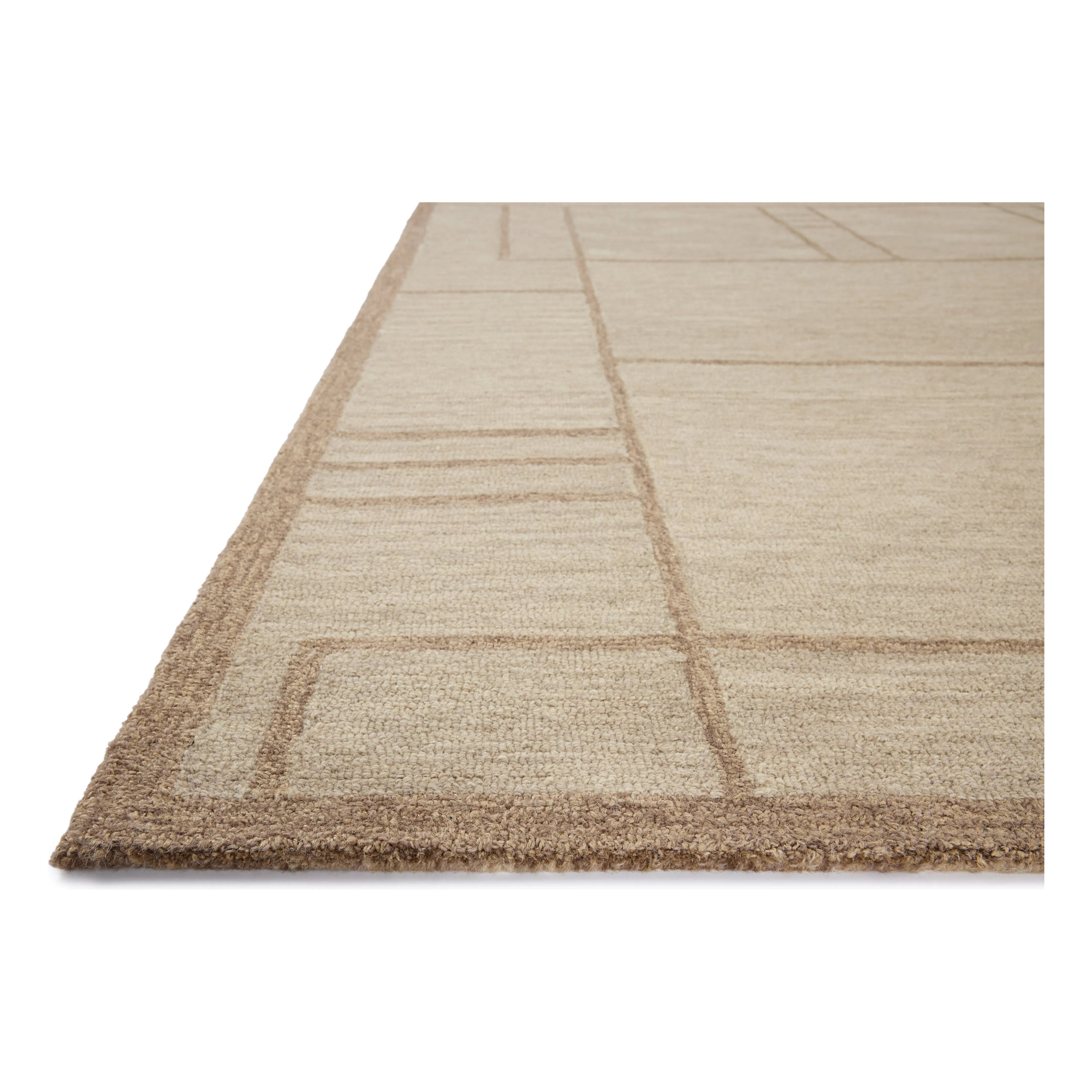 The Barrow Collection by Jeremiah Brent x Loloi is a hand-tufted area rug with a bold linear design inspired by modern art and classical architecture. The rugs pile is a blend of wool and jute for a stable, substantial feel that can ground living rooms, dining rooms, bedrooms, and more. Amethyst Home provides interior design, new home construction design consulting, vintage area rugs, and lighting in the San Diego metro area.