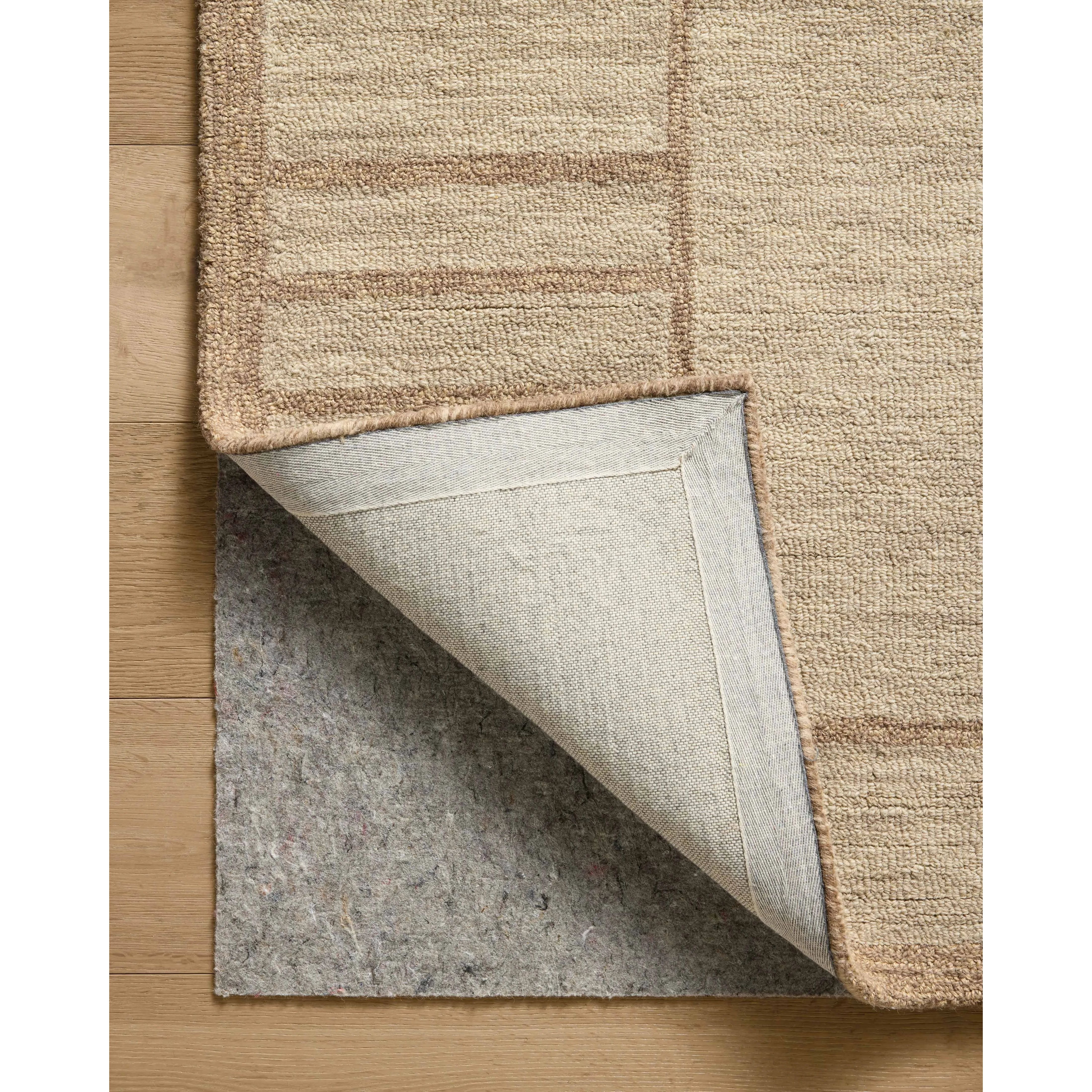 The Barrow Collection by Jeremiah Brent x Loloi is a hand-tufted area rug with a bold linear design inspired by modern art and classical architecture. The rugs pile is a blend of wool and jute for a stable, substantial feel that can ground living rooms, dining rooms, bedrooms, and more. Amethyst Home provides interior design, new home construction design consulting, vintage area rugs, and lighting in the Winter Garden metro area.