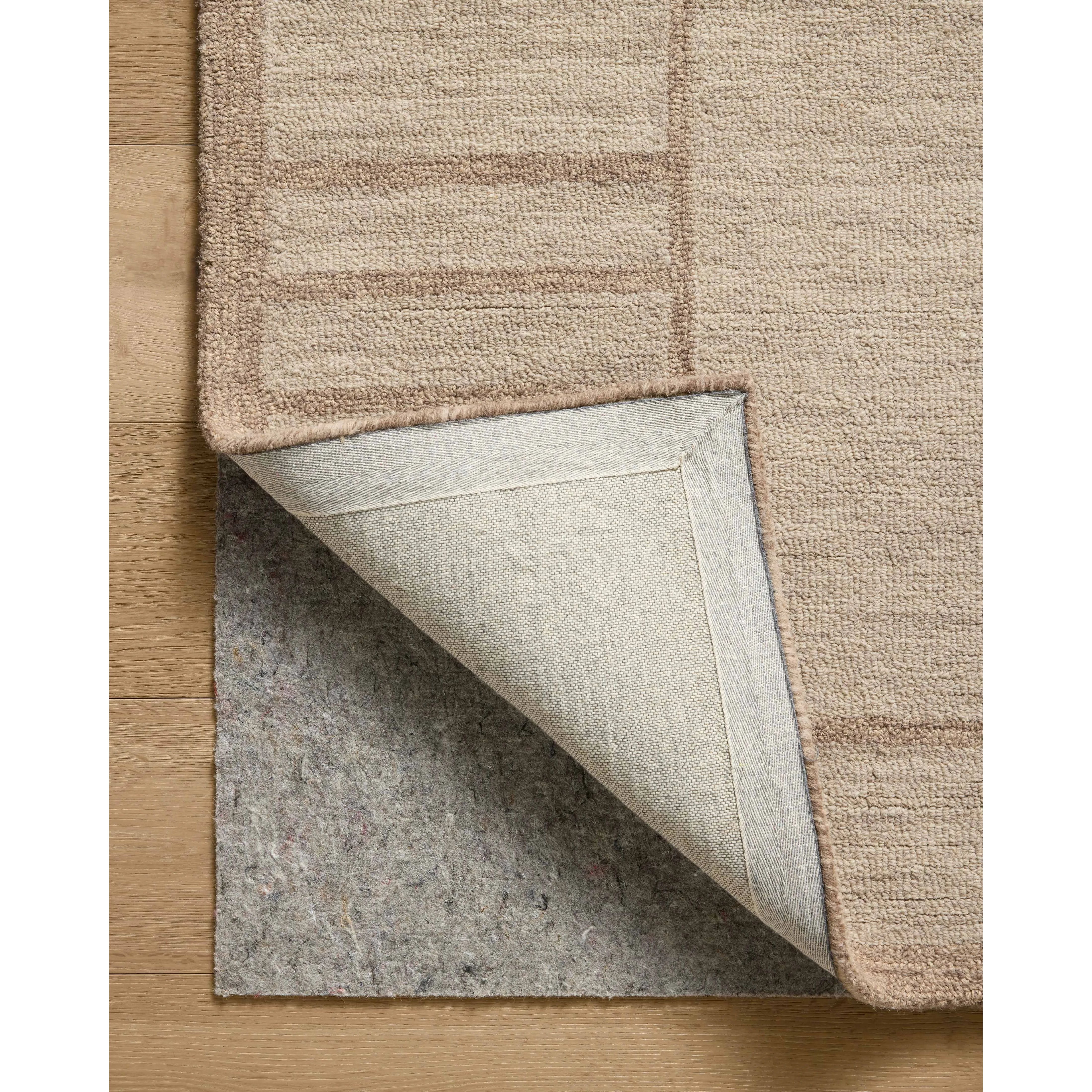 The Barrow Collection by Jeremiah Brent x Loloi is a hand-tufted area rug with a bold linear design inspired by modern art and classical architecture. The rug’s pile is a blend of wool and jute for a stable, substantial feel that can ground living rooms, dining rooms, bedrooms, and more. Amethyst Home provides interior design, new home construction design consulting, vintage area rugs, and lighting in the Winter Garden metro area.