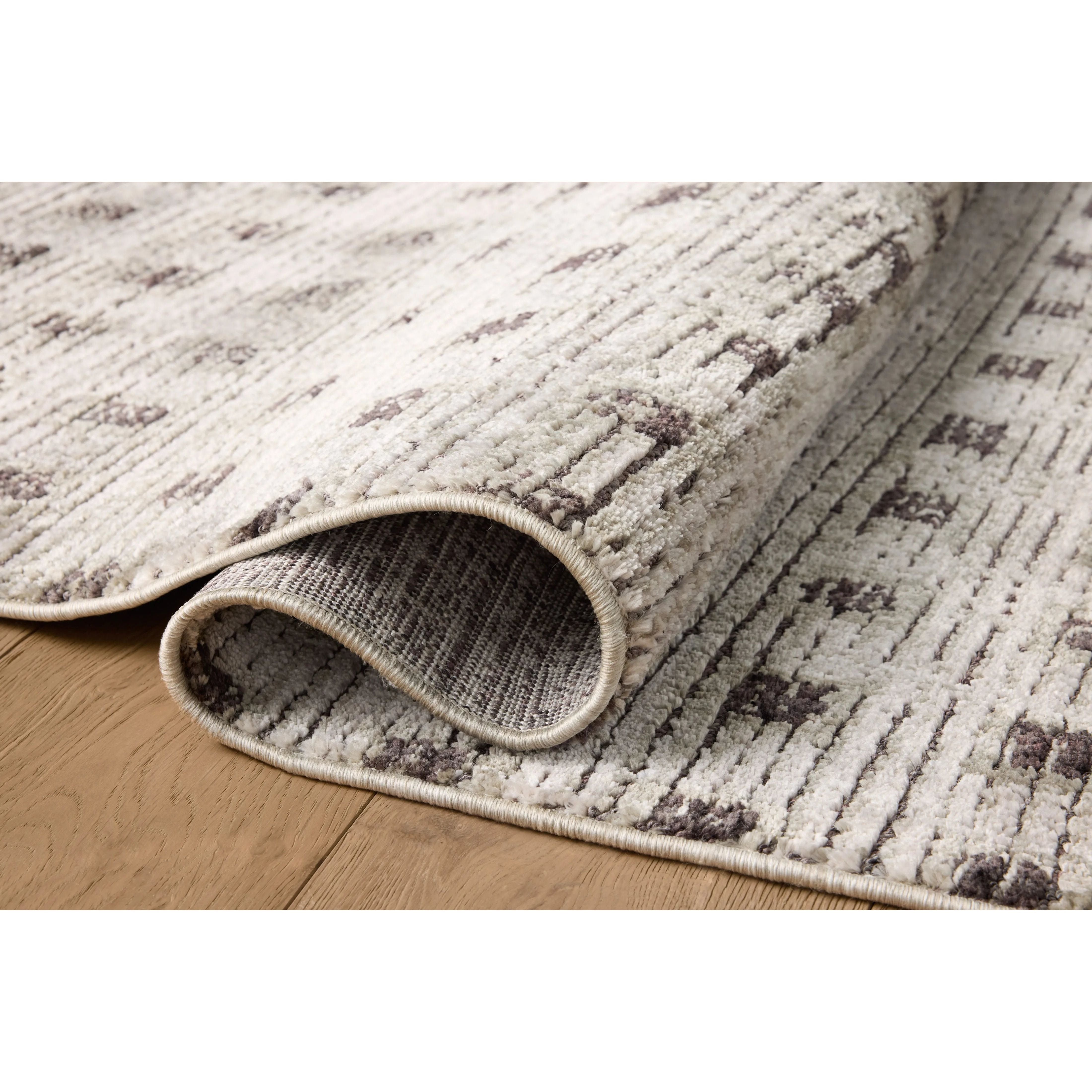 The Bleecker Collection by Jeremiah Brent x Loloi is a soft, power-loomed rug in warm colorways that change in different lighting. With high-contrast linear patterns and careful distressing, Bleecker represents Jeremiah love of modern design. Amethyst Home provides interior design, new home construction design consulting, vintage area rugs, and lighting in the Los Angeles metro area.