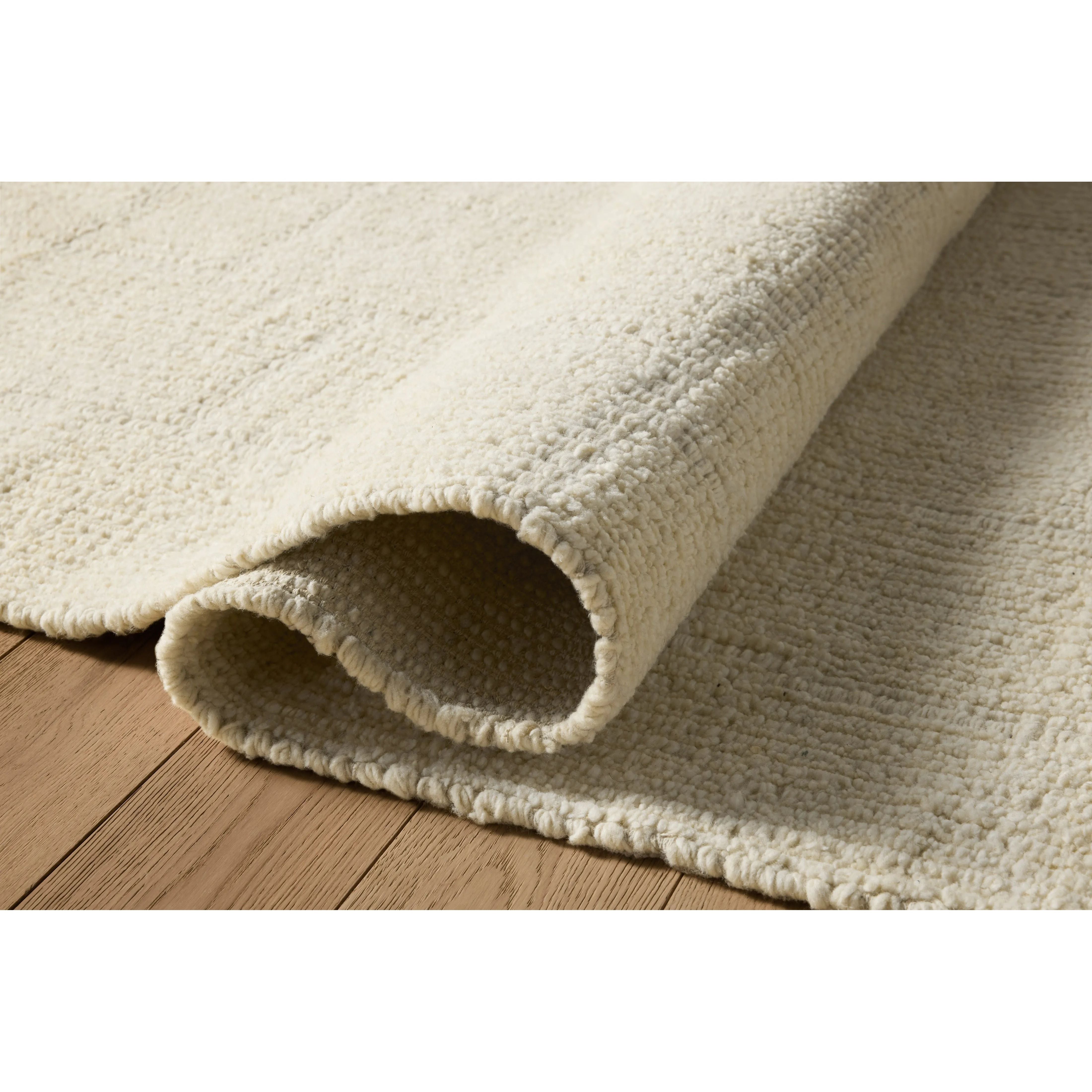 The Greenwich Collection by Jeremiah Brent x Loloi is a beautifully textured solid-toned area rug with subtle pile variation. Jeremiah loves this collection for its rich colors rooted in nature and a blended wool-and-cotton pile that’s softer and more malleable than typical wool. Amethyst Home provides interior design, new home construction design consulting, vintage area rugs, and lighting in the Nashville metro area.