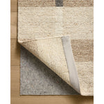 The Perry Collection by Jeremiah Brent x Loloi is a singular area rug made with a special soumak weave construction, a labor-intensive process that creates beautiful details and a sturdy, thick weave. Perry combines a traditional craft with a modern linear pattern in rich yet muted colors. Amethyst Home provides interior design, new home construction design consulting, vintage area rugs, and lighting in the Austin metro area.