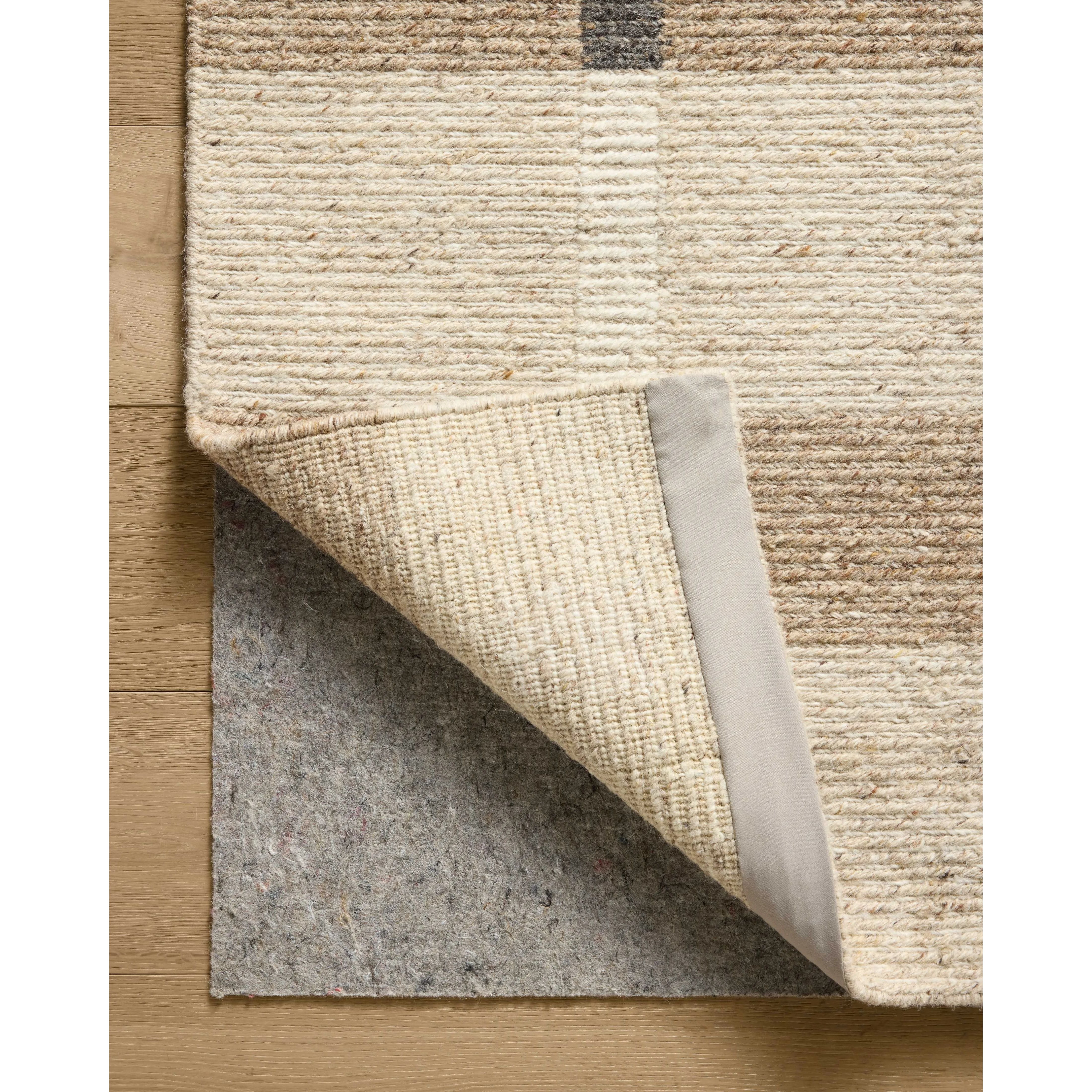 The Perry Collection by Jeremiah Brent x Loloi is a singular area rug made with a special soumak weave construction, a labor-intensive process that creates beautiful details and a sturdy, thick weave. Perry combines a traditional craft with a modern linear pattern in rich yet muted colors. Amethyst Home provides interior design, new home construction design consulting, vintage area rugs, and lighting in the Austin metro area.