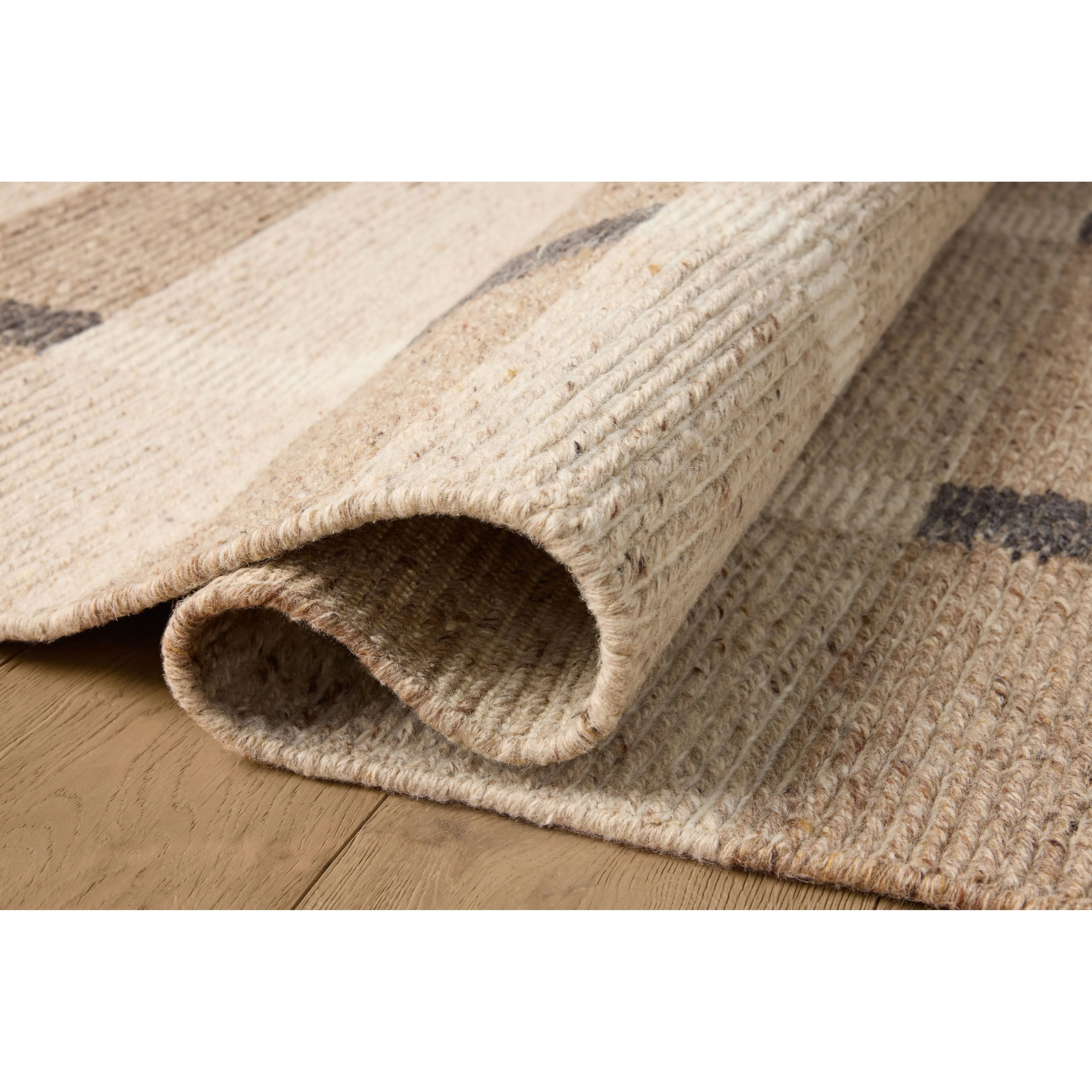The Perry Collection by Jeremiah Brent x Loloi is a singular area rug made with a special soumak weave construction, a labor-intensive process that creates beautiful details and a sturdy, thick weave. Perry combines a traditional craft with a modern linear pattern in rich yet muted colors. Amethyst Home provides interior design, new home construction design consulting, vintage area rugs, and lighting in the Park City metro area.