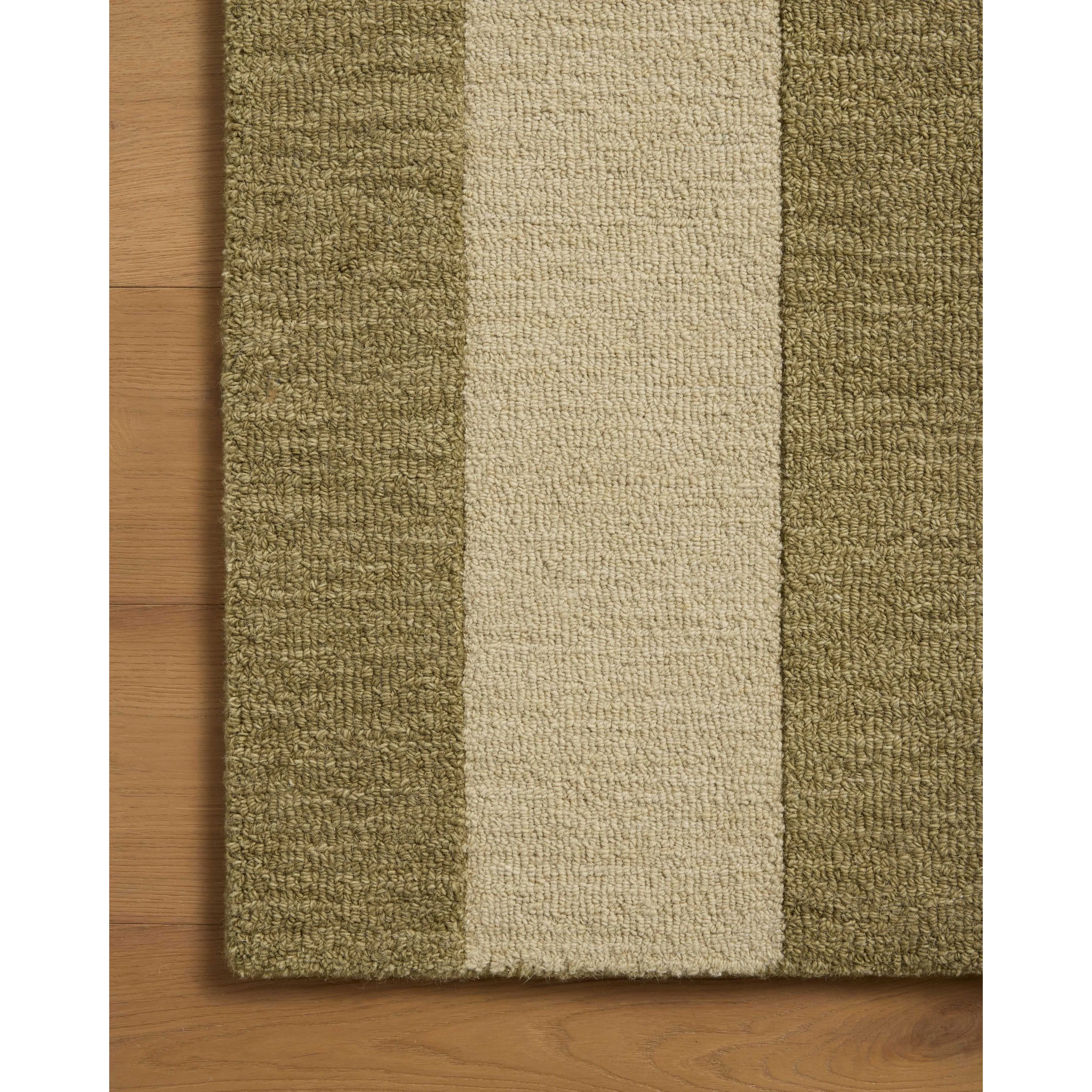 The Craven Collection is a hand-tufted area rug based on designs by Leanne Ford and made in collaboration with Loloi. Ford sketched classic stripes and checkerboards with an organic, free-flowing hand. The design comes to life with subtle space-dyed wool in creamy neutrals and rich, earthy tones. Amethyst Home provides interior design, new home construction design consulting, vintage area rugs, and lighting in the Dallas metro area.