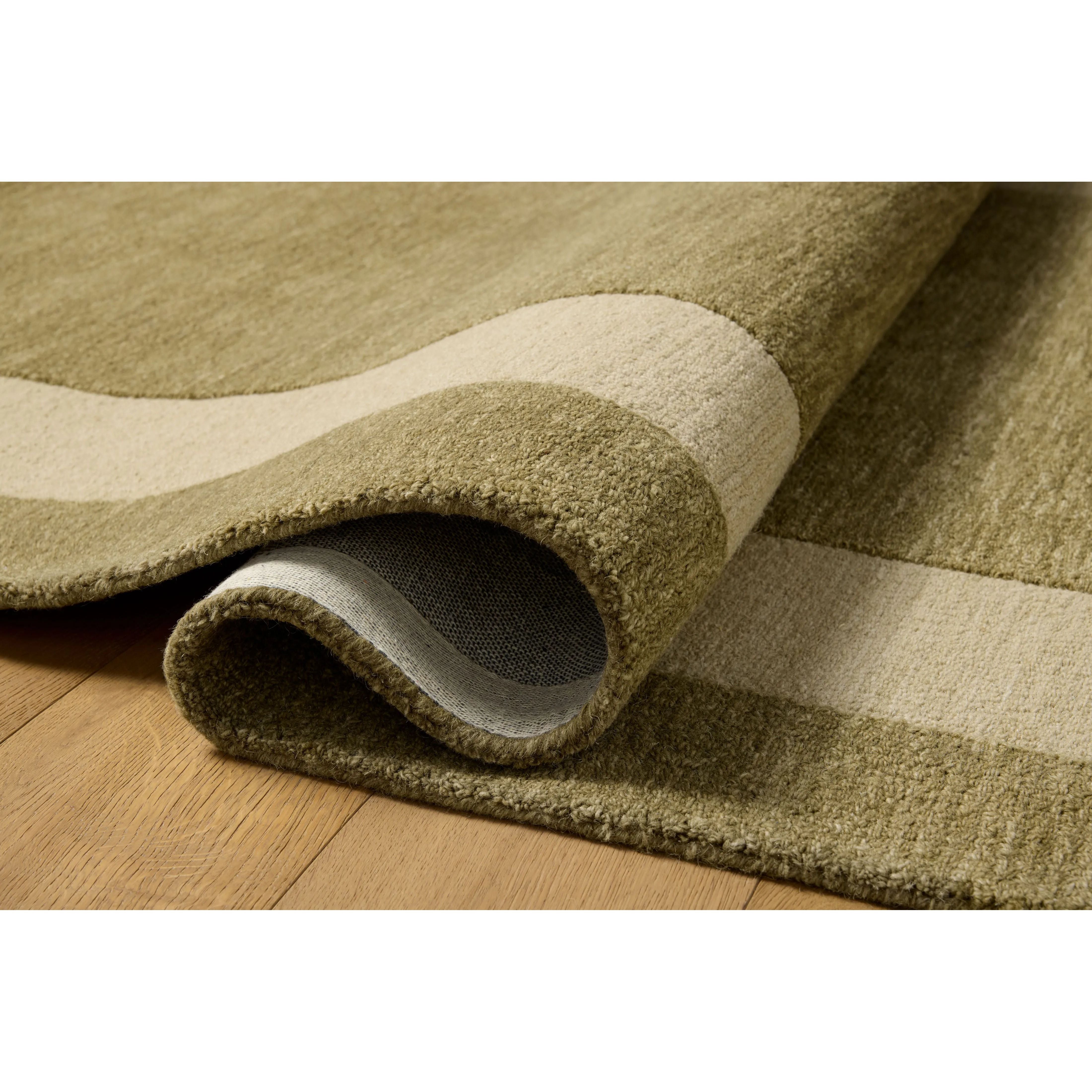 The Craven Collection is a hand-tufted area rug based on designs by Leanne Ford and made in collaboration with Loloi. Ford sketched classic stripes and checkerboards with an organic, free-flowing hand. The design comes to life with subtle space-dyed wool in creamy neutrals and rich, earthy tones. Amethyst Home provides interior design, new home construction design consulting, vintage area rugs, and lighting in the Los Angeles metro area.