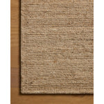 The Lennox Collection by Leanne Ford x Loloi is a statement area rug made with natural undyed wool that reveals subtle color differentiation in creamy neutral tones. The rug is hand-woven with a labor-intensive soumak weave, alternating rows of thick and thin looped yarns for an organic, inviting texture. Amethyst Home provides interior design, new home construction design consulting, vintage area rugs, and lighting in the Tampa metro area.