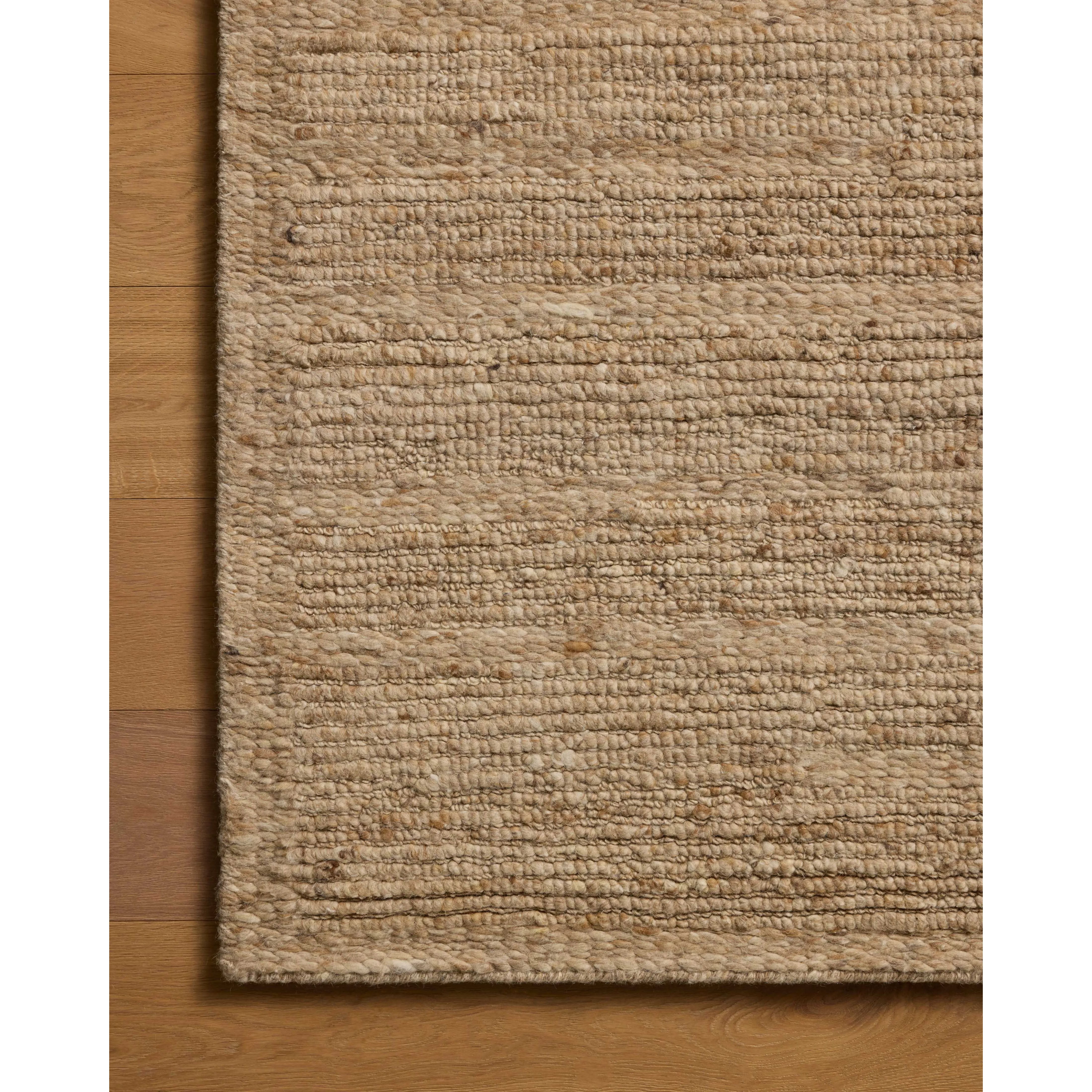 The Lennox Collection by Leanne Ford x Loloi is a statement area rug made with natural undyed wool that reveals subtle color differentiation in creamy neutral tones. The rug is hand-woven with a labor-intensive soumak weave, alternating rows of thick and thin looped yarns for an organic, inviting texture. Amethyst Home provides interior design, new home construction design consulting, vintage area rugs, and lighting in the Tampa metro area.
