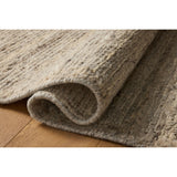 The Lennox Collection by Leanne Ford x Loloi is a statement area rug made with natural undyed wool that reveals subtle color differentiation in creamy neutral tones. The rug is hand-woven with a labor-intensive soumak weave, alternating rows of thick and thin looped yarns for an organic, inviting texture. Amethyst Home provides interior design, new home construction design consulting, vintage area rugs, and lighting in the Newport Beach metro area.