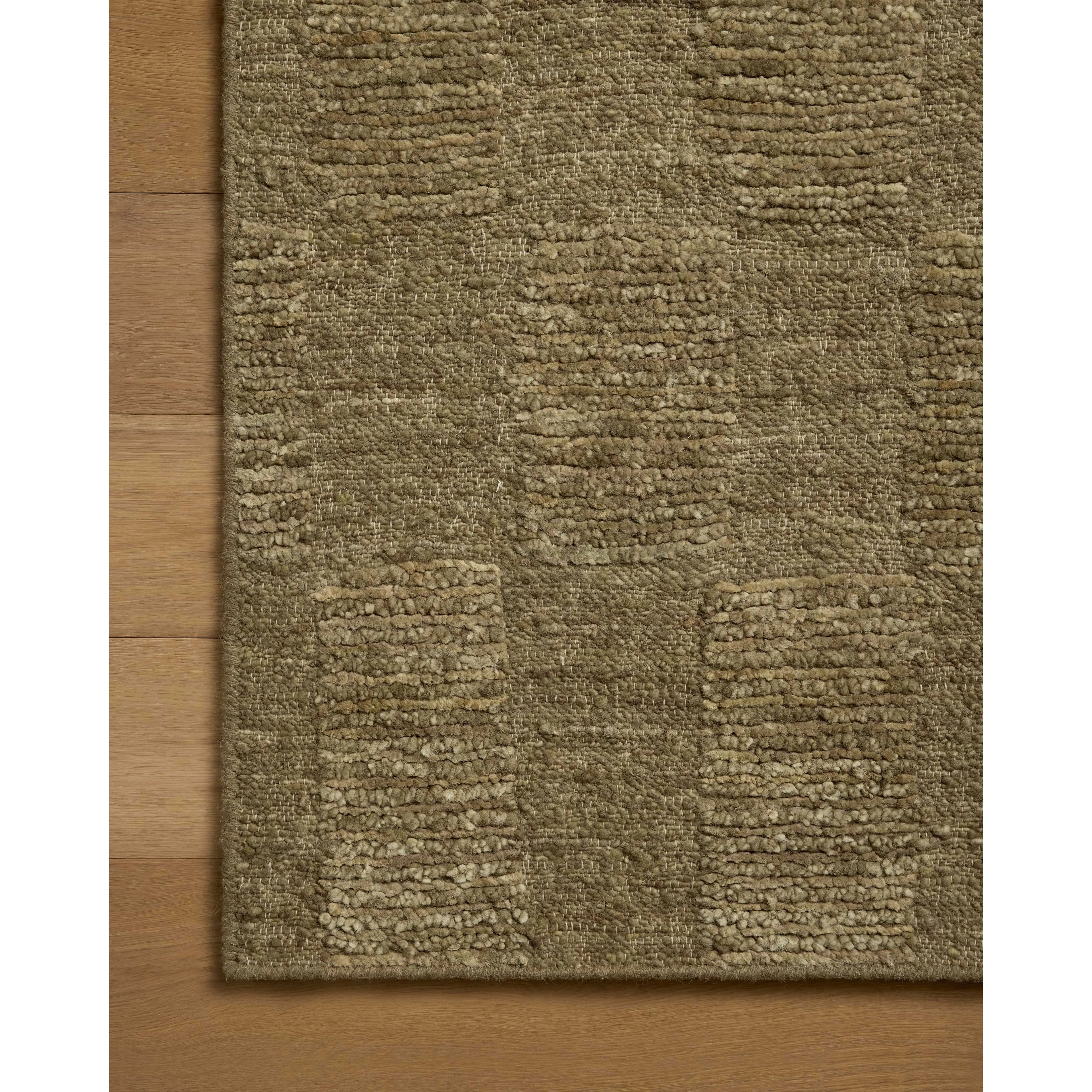 The Sowerby Collection is a wonderfully textural area rug by Leanne Ford x Loloi with a unique construction: alternating high-cut wool and jute pile on a nubby flatweave base to create an organic checkerboard pattern. Available in creamy neutrals and rich, earthy tones, Sowerby is a sophisticated neutral rug for living rooms, bedrooms, and more. Amethyst Home provides interior design, new home construction design consulting, vintage area rugs, and lighting in the Laguna Beach metro area.