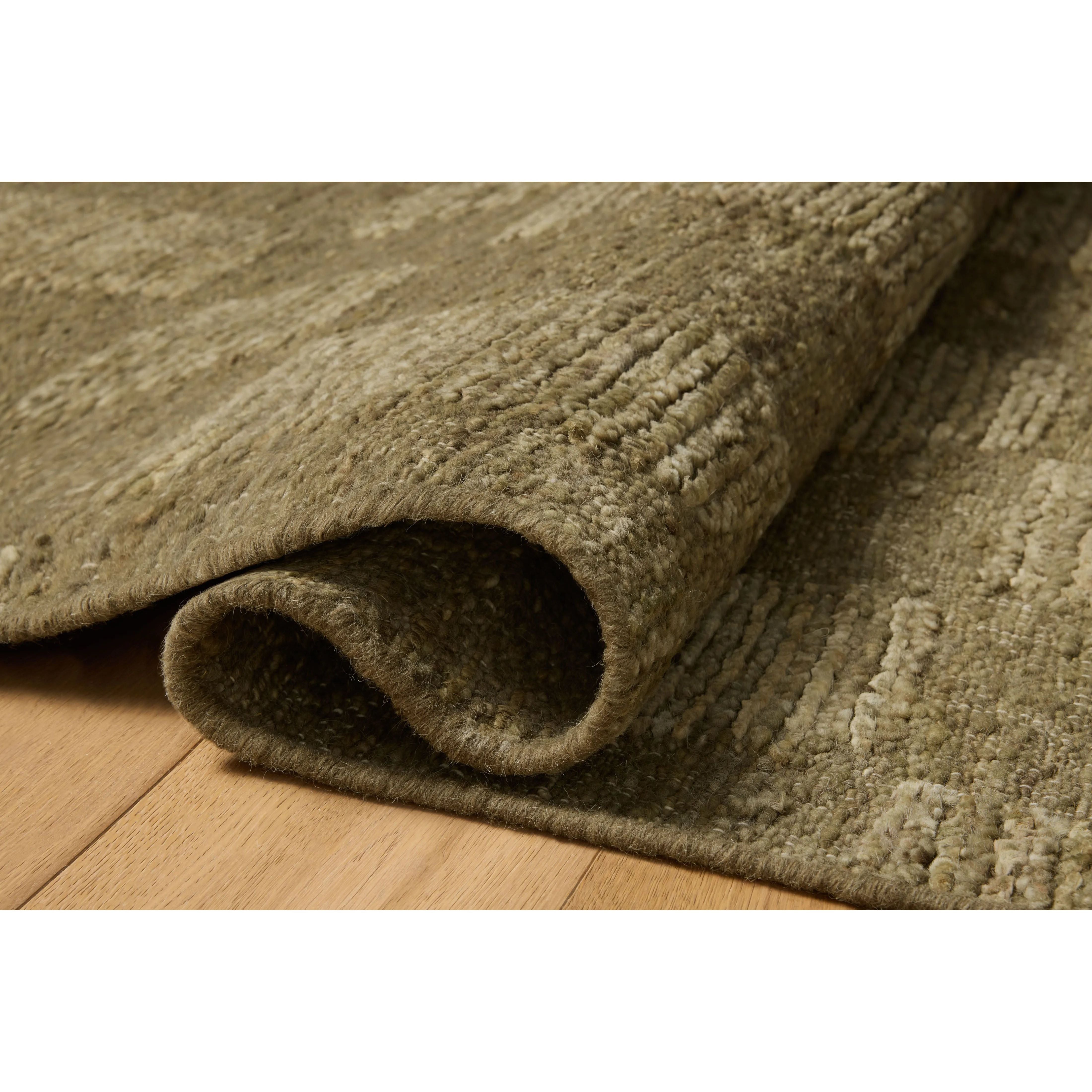 The Sowerby Collection is a wonderfully textural area rug by Leanne Ford x Loloi with a unique construction: alternating high-cut wool and jute pile on a nubby flatweave base to create an organic checkerboard pattern. Available in creamy neutrals and rich, earthy tones, Sowerby is a sophisticated neutral rug for living rooms, bedrooms, and more. Amethyst Home provides interior design, new home construction design consulting, vintage area rugs, and lighting in the Nashville metro area.