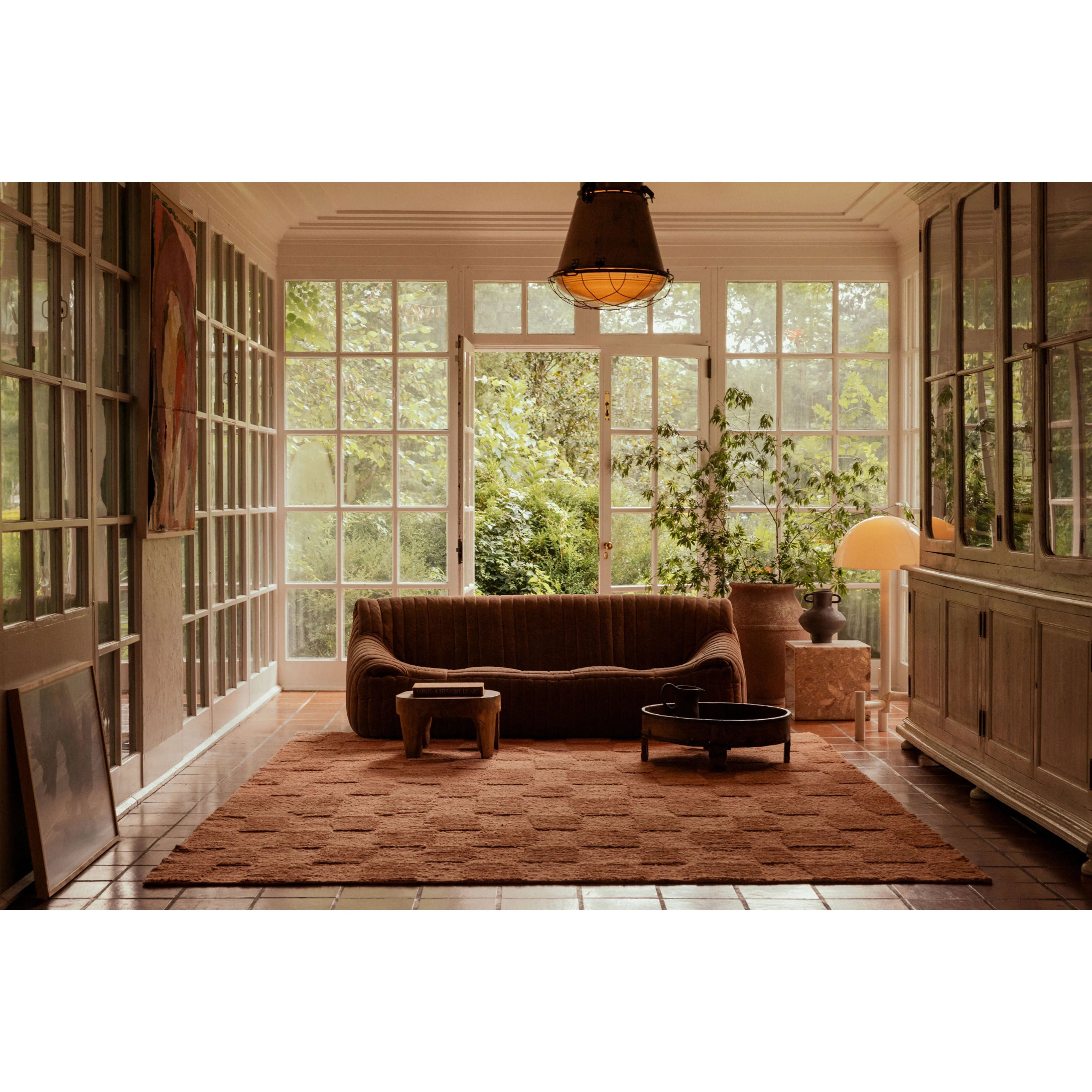 The Sowerby Collection is a wonderfully textural area rug by Leanne Ford x Loloi with a unique construction: alternating high-cut wool and jute pile on a nubby flatweave base to create an organic checkerboard pattern. Available in creamy neutrals and rich, earthy tones, Sowerby is a sophisticated neutral rug for living rooms, bedrooms, and more. Amethyst Home provides interior design, new home construction design consulting, vintage area rugs, and lighting in the Boston metro area.