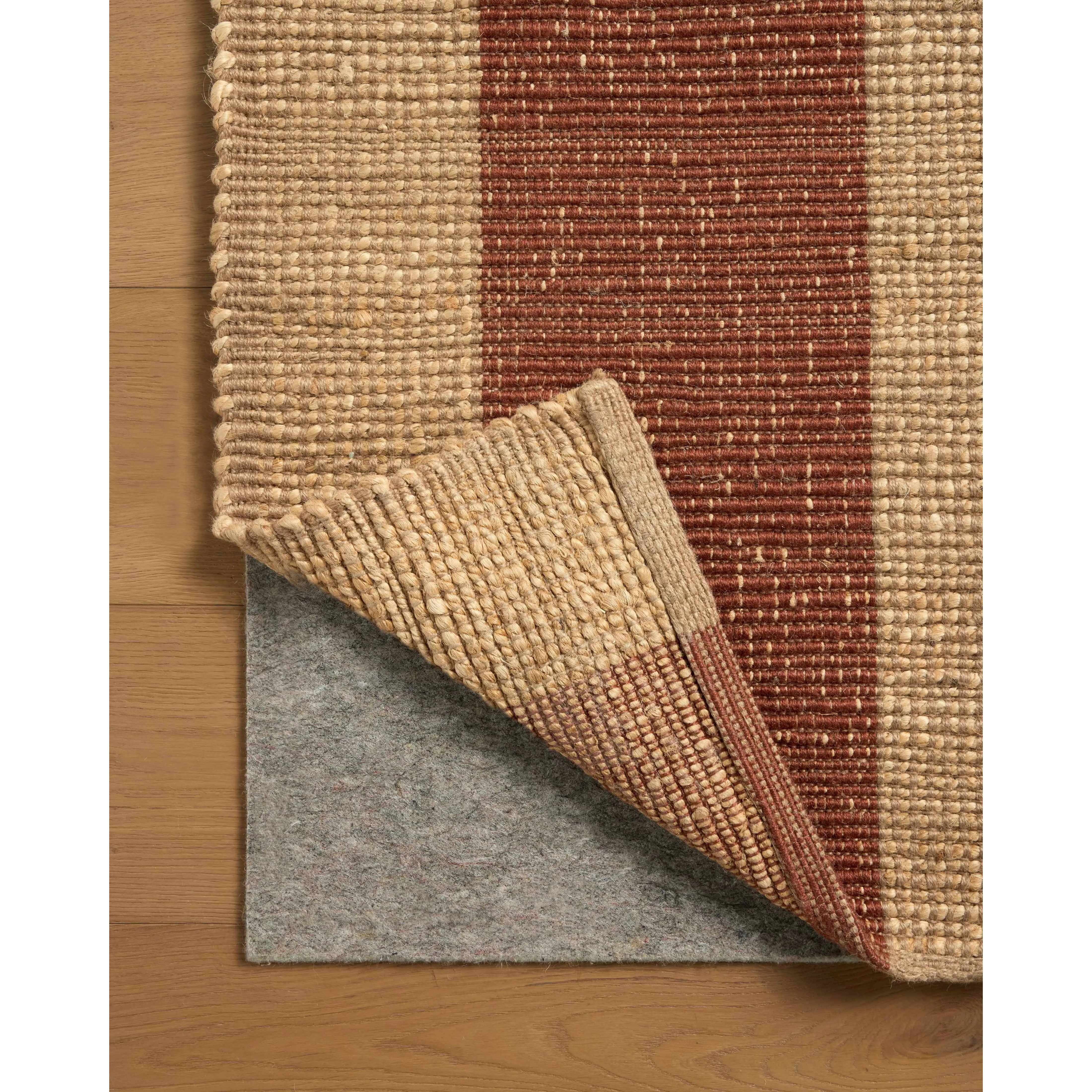 The Weatherstaff Collection is a vertically striped jute area rug with an organic look and feel, designed by Leanne Ford x Loloi. The earth-toned area rug features flatwoven jute that creates a ribbed texture horizontally, with stripes that are vertical—a playful combination. Amethyst Home provides interior design, new home construction design consulting, vintage area rugs, and lighting in the Portland metro area.