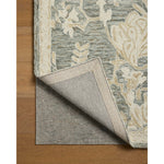 The Lenore Collection is a floral wool area rug with a two-toned design for elegant home decor. The rug's intricate linework is cut pile and the base is looped yarn, which gives the florals a slightly raised appearance and lovely depth. Amethyst Home provides interior design, new home construction design consulting, vintage area rugs, and lighting in the Omaha metro area.