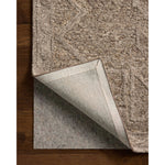 The Mabel Collection is a chunky wool area rug with a modernized take on traditional Turkish design. The rugs pattern rises with a higher pile for added dimension, while the neutral stone palette makes it easy to style in living rooms, bedrooms, and more. Amethyst Home provides interior design, new home construction design consulting, vintage area rugs, and lighting in the Tampa metro area.
