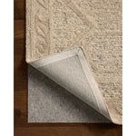 The Mabel Collection is a chunky wool area rug with a modernized take on traditional Turkish design. The rugs pattern rises with a higher pile for added dimension, while the neutral stone palette makes it easy to style in living rooms, bedrooms, and more. Amethyst Home provides interior design, new home construction design consulting, vintage area rugs, and lighting in the Omaha metro area.