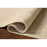 The Maren Collection is a unique handmade area rug made with a new technique that creates a dotted texture, almost like fine embroidery, but with a substantial hand-loomed feel. The pile reveals modern geometric patterns with organic shapes and natural softness, available in light, easygoing neutrals. Amethyst Home provides interior design, new home construction design consulting, vintage area rugs, and lighting in the Monterey metro area.