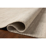 The Maren Collection is a unique handmade area rug made with a new technique that creates a dotted texture, almost like fine embroidery, but with a substantial hand-loomed feel. The pile reveals modern geometric patterns with organic shapes and natural softness, available in light, easygoing neutrals. Amethyst Home provides interior design, new home construction design consulting, vintage area rugs, and lighting in the Omaha metro area.