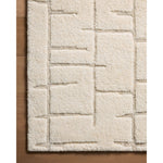 Featuring Octavia Ivory / Stone Rug by Loloi at Amethyst Home. Inspired by classic Moroccan rug motifs and nature's asymmetry, area rugs in the Octavia Collection make a timeless statement. This hand-knotted design plays with pile height and shapes while adding the warmth of wool in a fresh, natural palette. Made in India and GoodWeave-certified, ensuring . Amethyst Home provides interior design, new home construction design consulting, vintage area rugs, and lighting in the Alpharetta metro area.