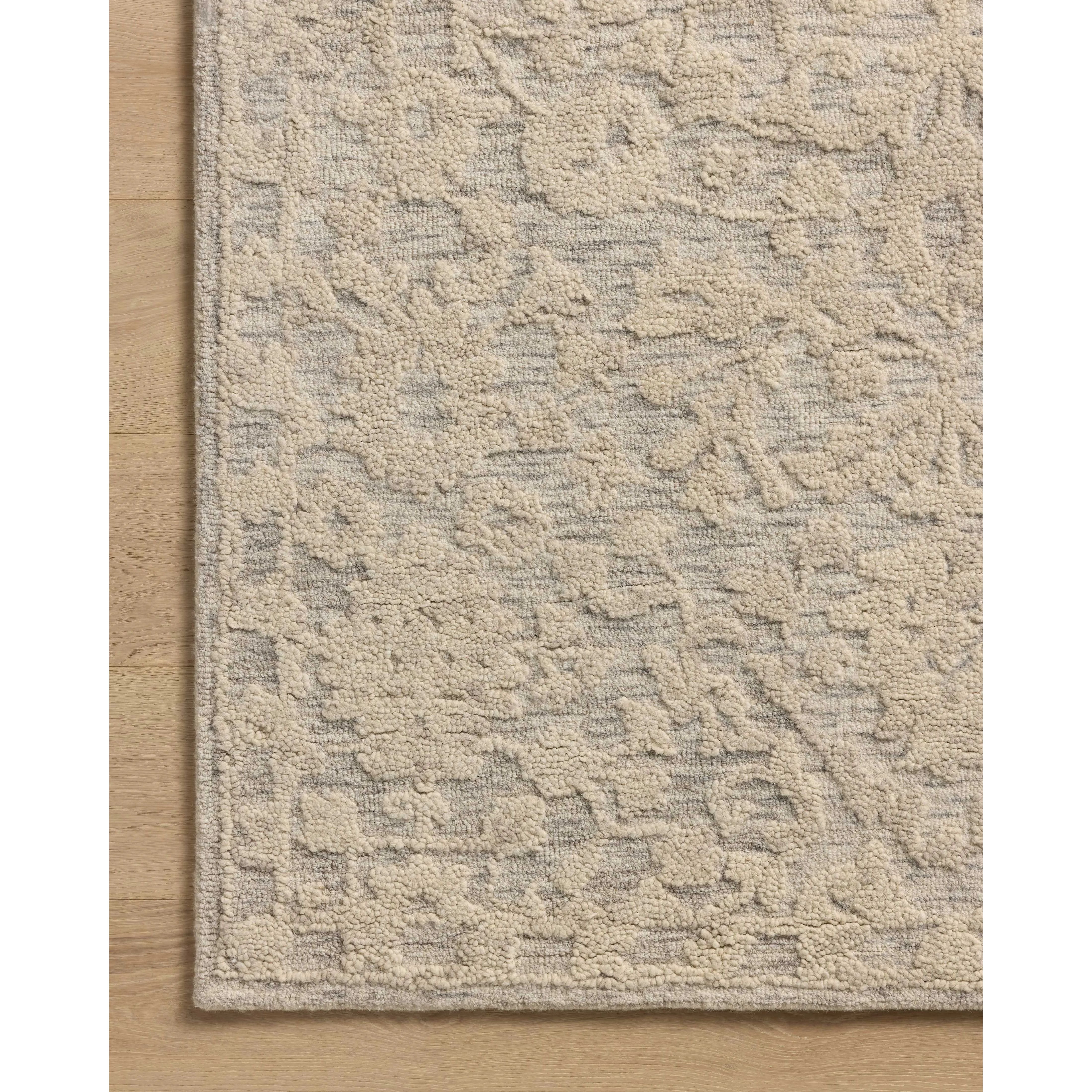 Featuring Prudence Mist / Ivory Rug by Loloi at Amethyst Home. The Prudence Collection is a hand-tufted area rug made of soft, space-dyed wool and cotton, which lends a subtle gradation of color throughout the floral design. The rugs background is low-looped, while the pattern is made with a chunky, higher loop to create even more depth in this sophisticated de. Amethyst Home provides interior design, new home construction design consulting, vintage area rugs, and lighting in the Miami metro area.