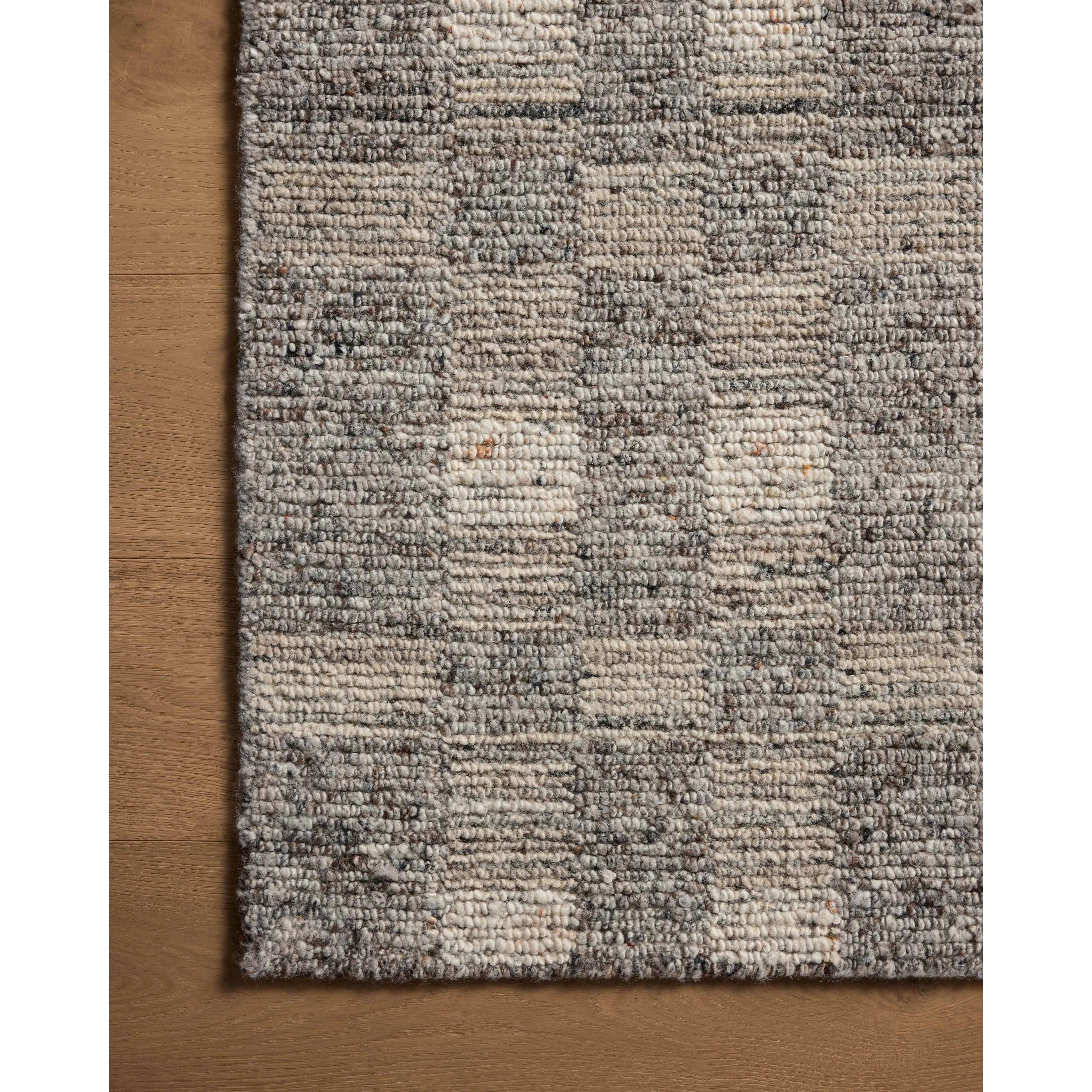 The Sonya Stone / Natural Rug is a hand-loomed area rug with a light, airy palette and understated graphic design. The rug’s textural pile is a soft blend of wool and nylon that creates dimension in living rooms, bedrooms, and more. Amethyst Home provides interior design, new home construction design consulting, vintage area rugs, and lighting in the Tampa metro area.