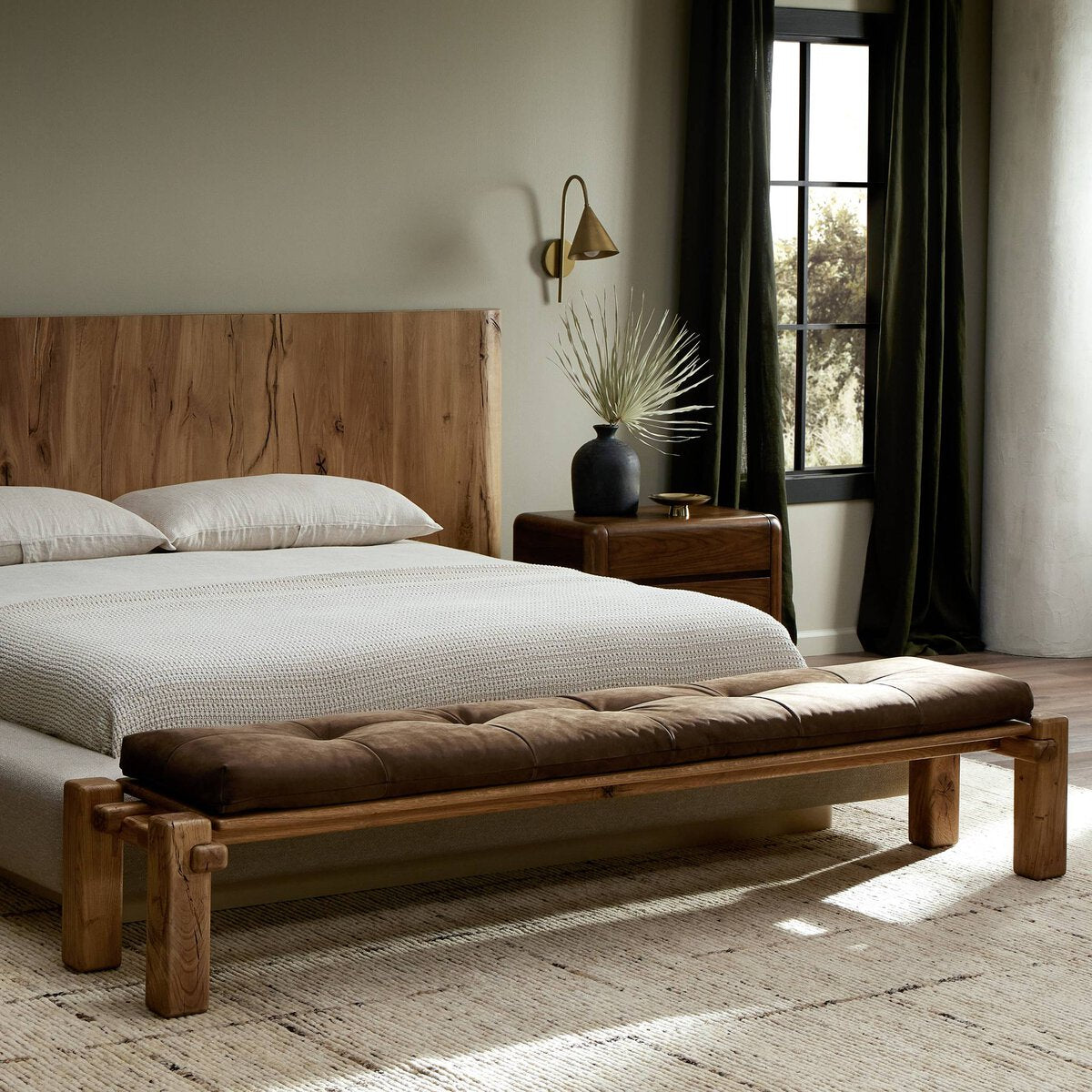 Featuring Marcia Nubuck Cigar Accent Bench by Four Hands at Amethyst Home. Designed by Thomas Bina and Ronald Sasson, a design partnership blending both modern minimalist and Brazilian influences. Crafted from natural reclaimed French oak with overstated joint details, with a top-grain leather cushion for comfort. Rounded edges bring a soft, playful feel to the entire piece.Overal. Amethyst Home provides interior design, new construction, custom furniture, and area rugs in the Charlotte metro area
