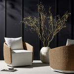 Featuring Maven Alessi Linen Outdoor Swivel Chair by Four Hands at Amethyst Home. Sustainably made with zero waste, luxurious Italian upholstery places a new and unique spin on indoor/outdoor seating, offering soft, durable fabric that's highly resistant to sun, stains, mold and abrasion. Shell framing of faux hyacinth weaves for extra texture atop a 360-degree swivel. Cover or st. Amethyst Home provides interior design, new construction, custom furniture, and area rugs in the San Diego metro area