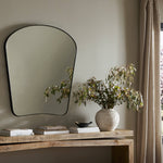Featuring Merona Iron Matte Black Mantel Mirror by Four Hands at Amethyst Home. A swooped silhouette creates rounded corners while maintaining a sleek overall look.Overall Dimensions: 39.00"w x 2.00"d x 44.00"hWeight : 66.40 lbsMaterials : Iron, Mirror, Engineered Hardwood. Amethyst Home provides interior design, new construction, custom furniture, and area rugs in the Calabasas metro area