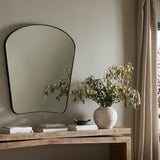 Featuring Merona Iron Matte Black Mantel Mirror by Four Hands at Amethyst Home. A swooped silhouette creates rounded corners while maintaining a sleek overall look.Overall Dimensions: 39.00"w x 2.00"d x 44.00"hWeight : 66.40 lbsMaterials : Iron, Mirror, Engineered Hardwood. Amethyst Home provides interior design, new construction, custom furniture, and area rugs in the Calabasas metro area