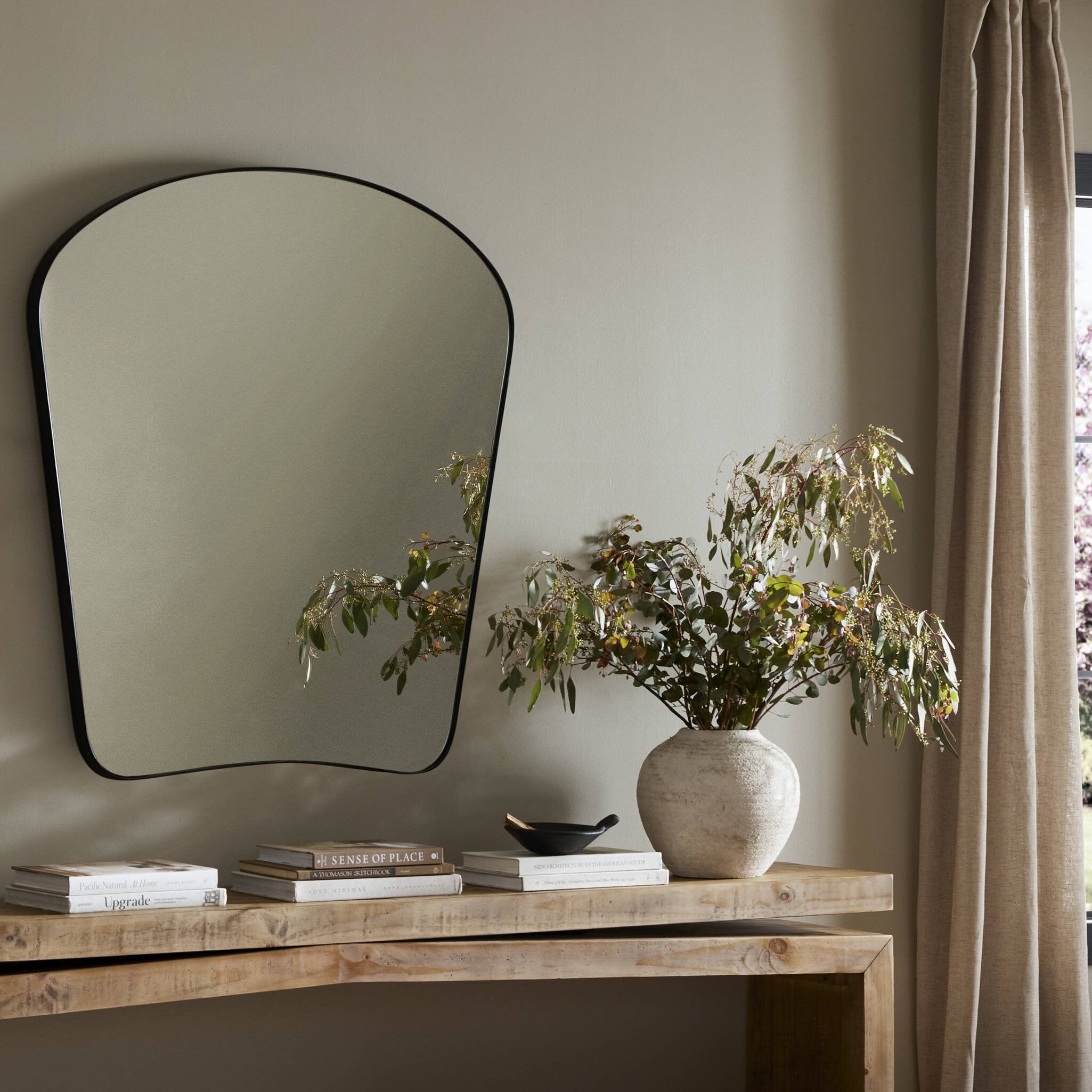 Featuring Merona Iron Matte Black Mantel Mirror by Four Hands at Amethyst Home. A swooped silhouette creates rounded corners while maintaining a sleek overall look.Overall Dimensions: 39.00"w x 2.00"d x 44.00"hWeight : 66.40 lbsMaterials : Iron, Mirror, Engineered Hardwood. Amethyst Home provides interior design, new construction, custom furniture, and area rugs in the Calabasas metro area