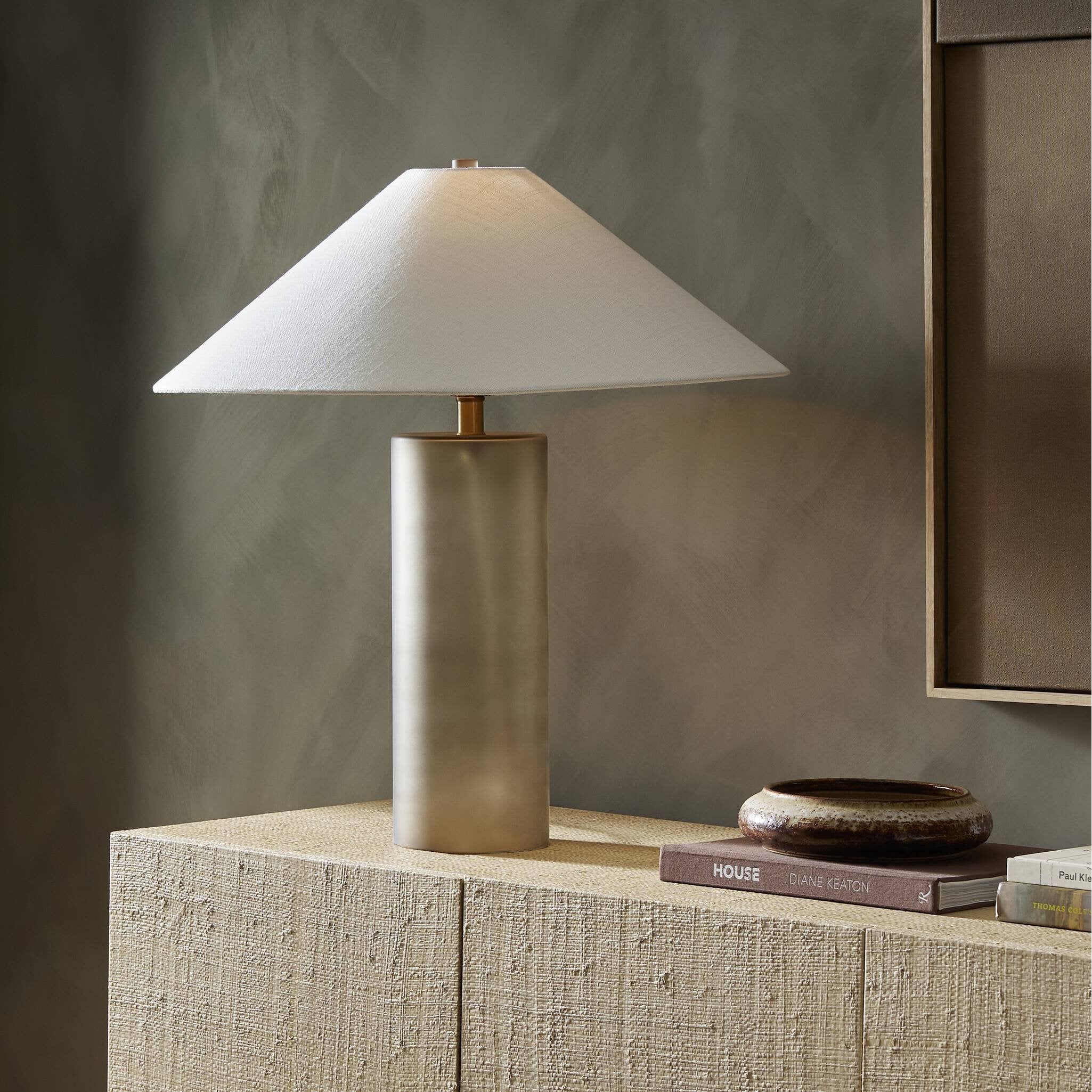 Featuring Patton Smoked Blown Glass Table Lamp by Four Hands at Amethyst Home. Inspired by Italian glass artisans, blown smoked glass forms a monolithic, cylindrical base. Topped with a short, tapered shade with a sharp finished edge.Overall Dimensions: 24.00"w x 24.00"d x 25.50"hWeight : 6.11 lbsMaterials : Cast Glass, Thermoplastic. Amethyst Home provides interior design, new construction, custom furniture, and area rugs in the Miami metro area