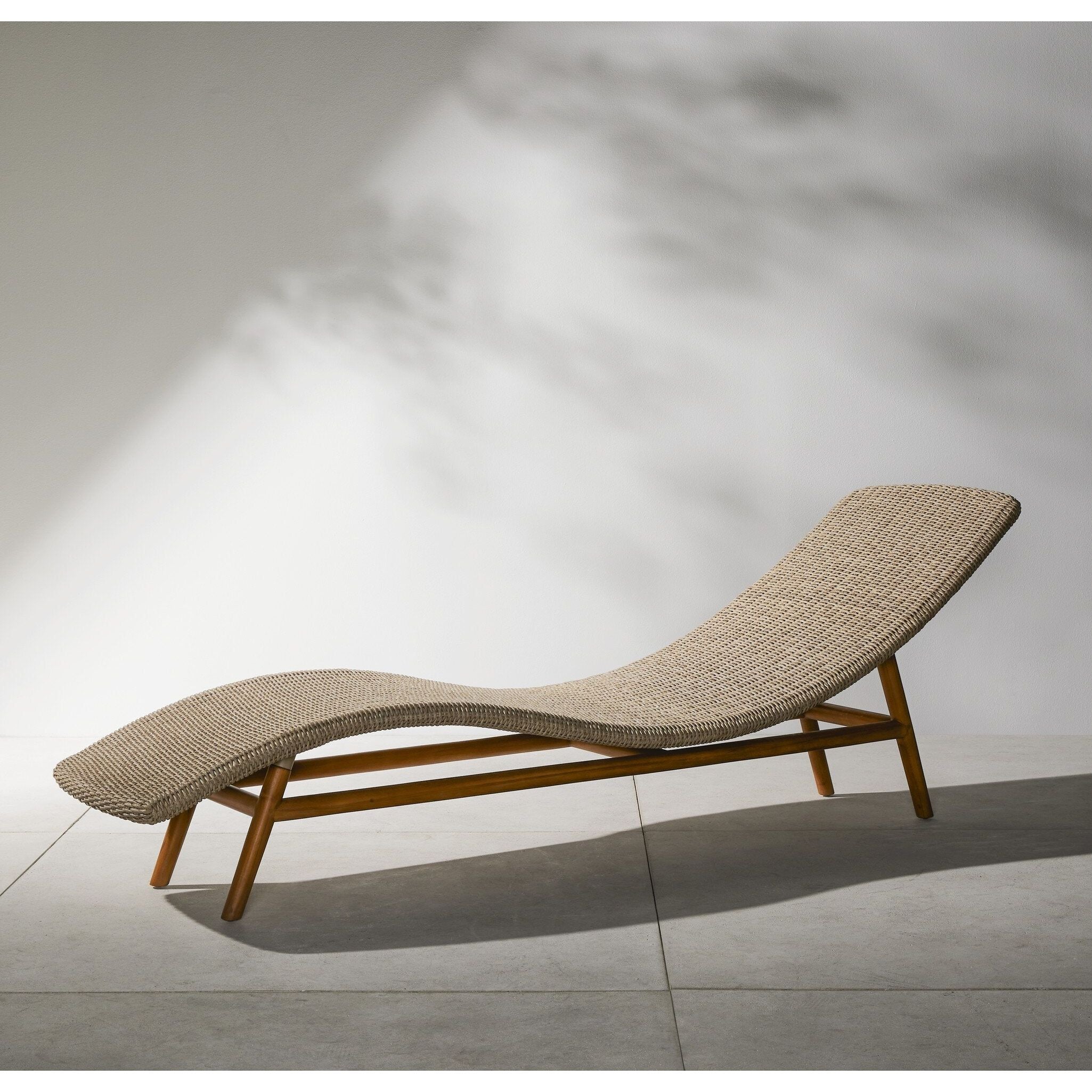 Featuring Portia Vintage White Outdoor Chaise by Four Hands at Amethyst Home. Strike a pose. Based off a vintage shape, all-weather wicker is subtly curved and set atop a minimal frame made of solid teak. A stylish statement piece and seating option for both indoors and out. Cover or store inside during inclement weather and when not in use.Overall Dimensions: 24.00"w x 80.50"d x 27.. Amethyst Home provides interior design, new construction, custom furniture, and area rugs in the Dallas metro area