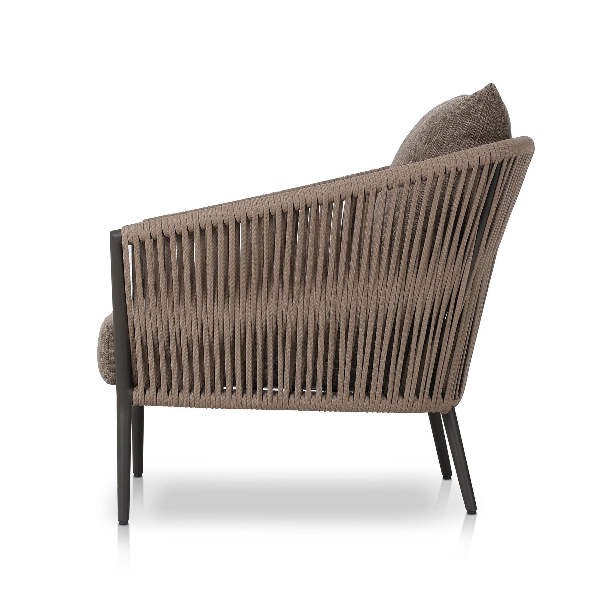 Featuring Porto Ellor Brown Outdoor Chair by Four Hands at Amethyst Home. The perfect place for outdoor daydreaming. A beautiful rope-based design is woven across a durable aluminum frame in a rich bronze finish. Topped with a wide cushion and throw pillow, all upholstered in 100% olefin, known for its UV-resistant, water-repellent and quick-drying abilities. Cover or store indoor. Amethyst Home provides interior design, new construction, custom furniture, and area rugs in the Charlotte metro area